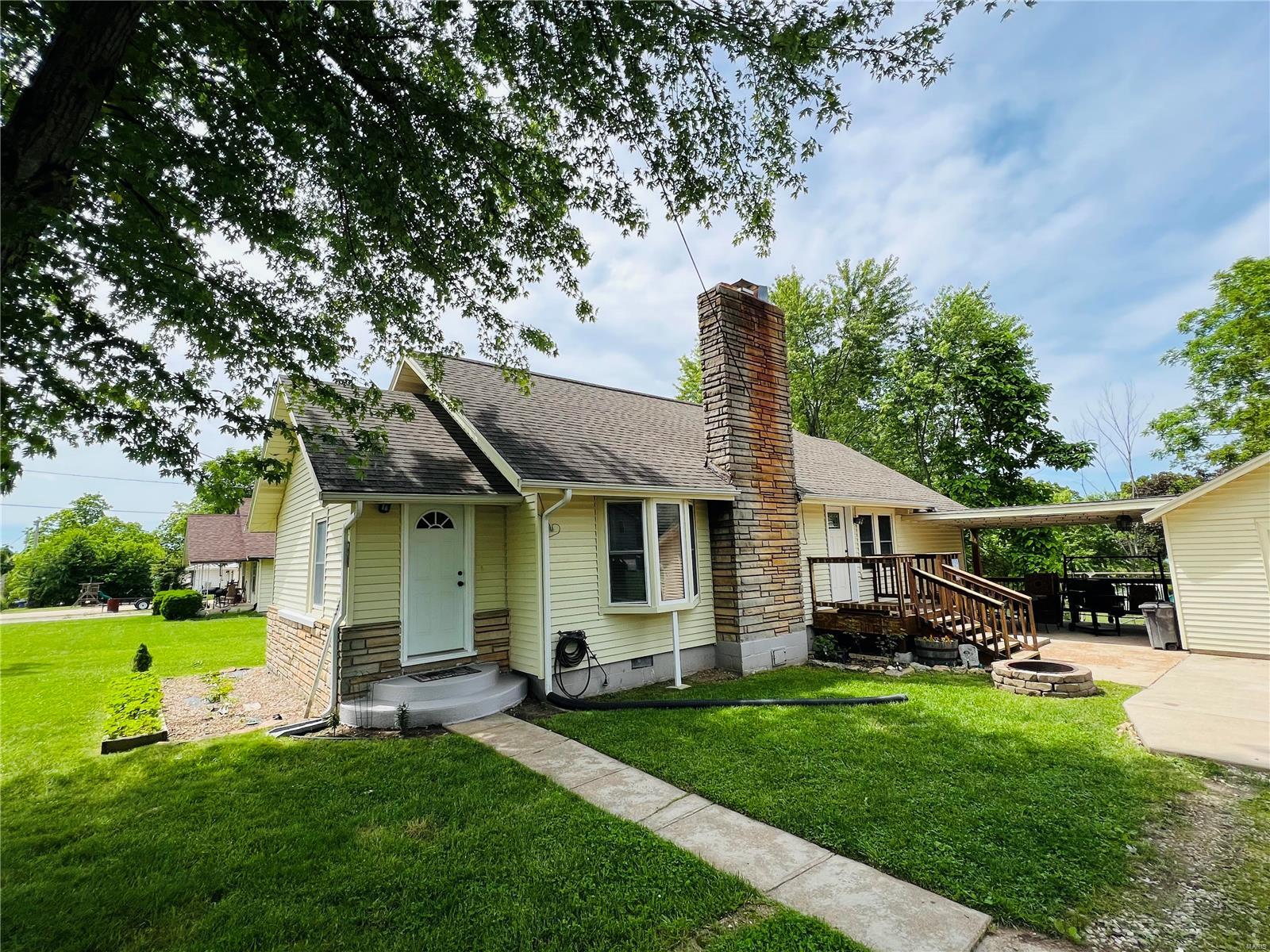 Classic Charm - welcoming home with just as much to offer outside as inside! Nicely-sized bedrooms and plenty of living space makes this home a charmer. Located only minutes from all three schools, grocery store and downtown. Plenty of play room in both the front and back yard. Covered outside area for sitting, grilling or relaxing. Detached garage is great for parking or a workshop. Home has a partial basement. Newer HVAC and plumbing updates.