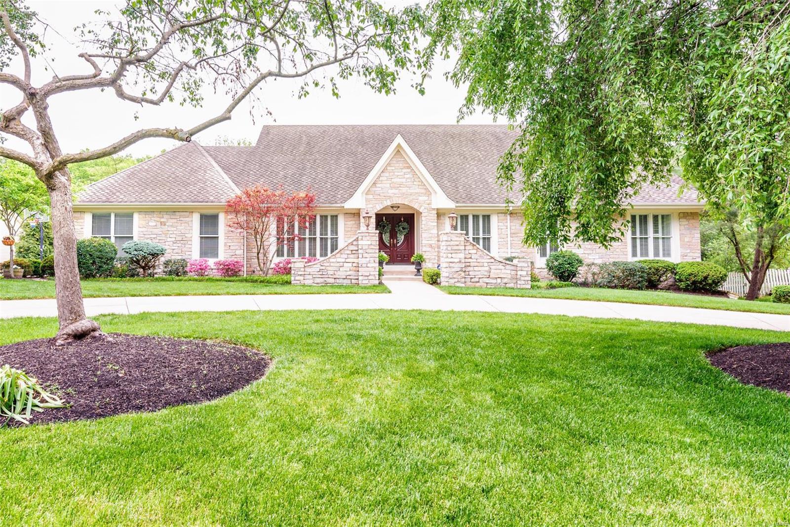Welcome to this custom, luxury home built by DeShetler Homes. Enjoy the outdoors on the one-acre serene yard on a quiet cul-de-sac. The lot features a composite Trex deck, which overlooks the custom gunite pool with pebble tech finish surrounded by a stone patio. You will love the privacy with the view of the woods behind you as the property backs to Chesterfield farm and creek. The exceptional craftsmanship cannot be missed in this home from the stone fireplaces with custom mantels to the custom kitchen cabinetry and granite countertops. You will love the details and character with plantation shutters and gorgeous Brazilian cherry hardwoods throughout the home, vaulted beamed great room and cathedral ceilings in the rec room. The master suite overlooks the pool and private yard with a brand-new vanity in the master bath. Laundry room is on main level with additional laundry hookups in the lower level. Master suite on lower level could be used as In-Law quarters and overlooks the pool.