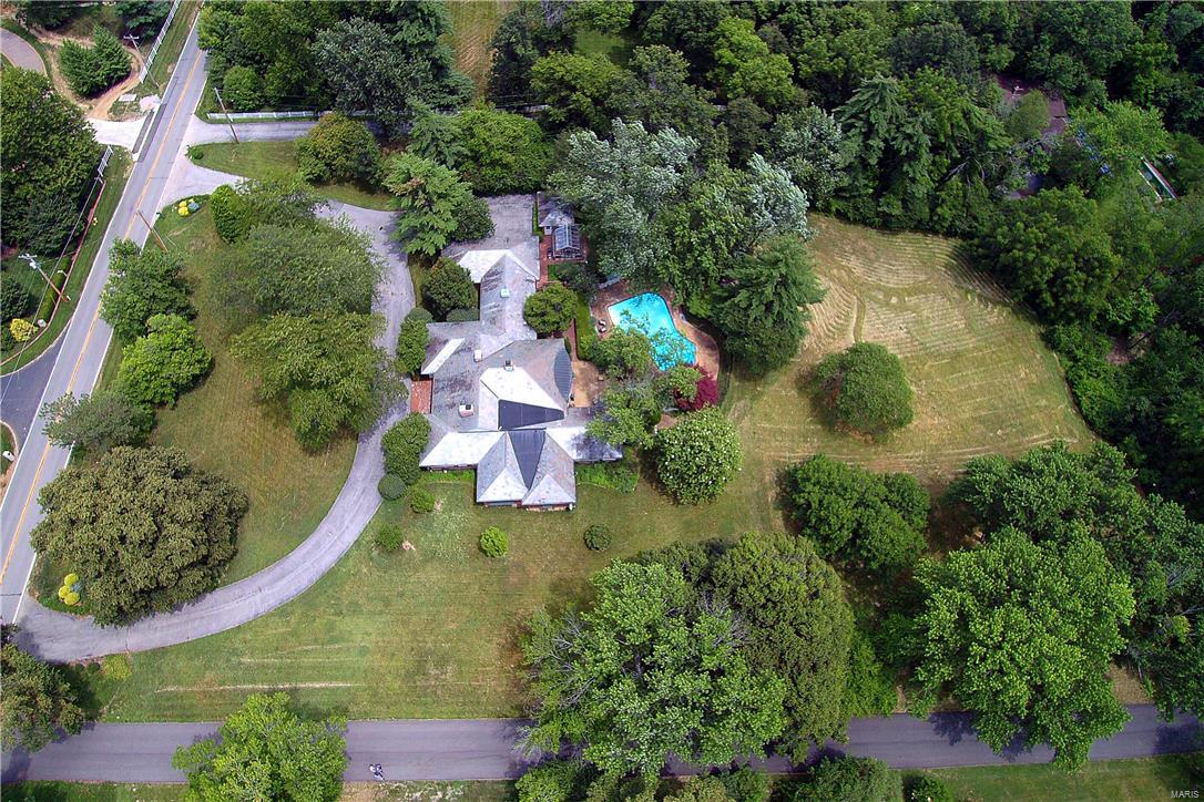 Premier 3-acre Ladue property. Ideal building site.  Will accommodate a deep pour walk out.  Survey with topographical info and tree locations available.  Fabulous location.  Call for more details.  Please do not walk property without an appt.  Existing house could be renovated.