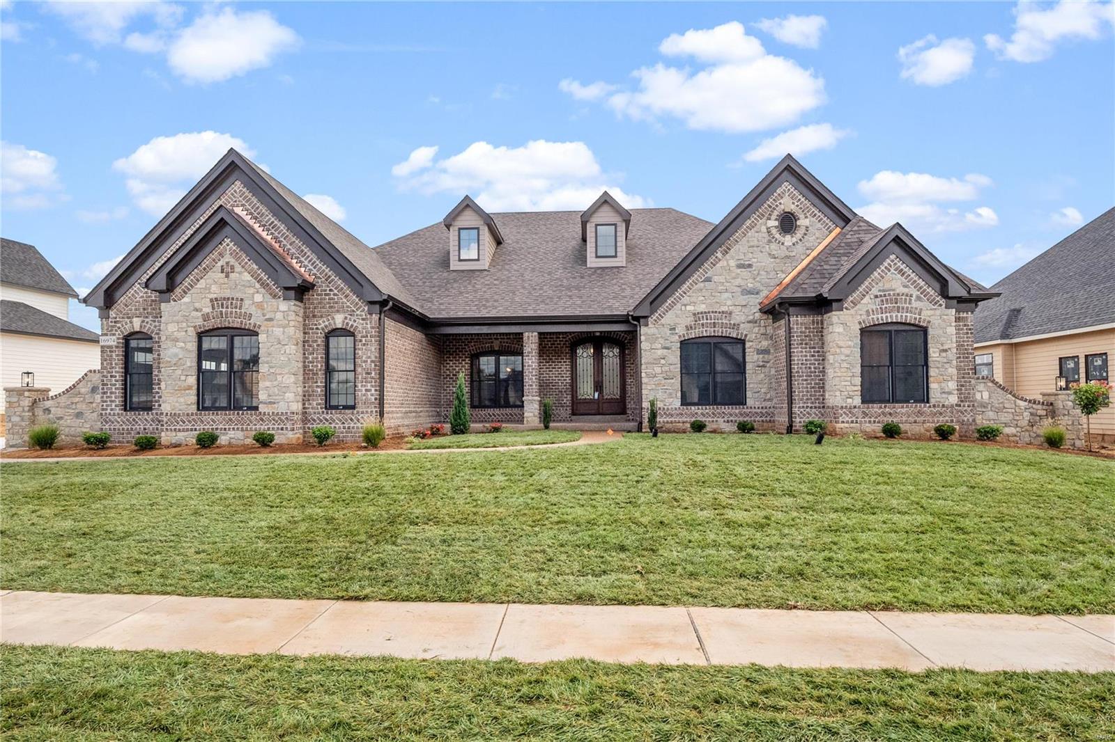 Newest Ranch Home Under Construction "The Kelly".  Purchase Now and make your selections!!! Built by one of St. Louis' premier hands-on builders Claymont Development, LLC-Wesley J. Byrne. A spacious 4br, 3.5ba 1-story w/appx 5600 sq ft of finished living space. This European Cottage elevation features a generous finish of brick and stone. 10' First Floor ceilings and an inviting 12' story great room w/gas fireplace and Atrium stairs. Gourmet kitchen w/custom cabs, stainless steel appliances & granite. The Vaulted Hearth Room is the perfect place to relax & unwind. Master suite w/ 2-pc crown & coffer ceiling, lux bath w/whirlpool tub & sep.shower. MF w/two beds with a J&J bath. LL featuring a Media Room and #4 bed and full bath. Four-car side entry garage, 10' LL found., screened-in deck & cedar sun deck, additional patio below. UNDER CONSTRUCTION!