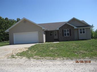 3 Bedroom 2 bath home with a garage with room for 3 cars or boat. The deck overlooks a little pond behind the home.  Property has a high efficiency  heat/air system to keep the bills low.  Home has 2x6 exterior walls.  Call for your personal showing.
