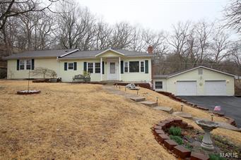 Sitting on almost 1 acre, this Ranch-style home offers 3 Bedrooms, 2 Full Baths and an OVER-SIZED 2 Car Garage. The Living Room and Dining Room offer laminate flooring. You will love the spacious, vaulted Master Bedroom that boasts 2 walk-in closets, recessed lighting, French doors out to the back deck where you can relax and enjoy the privacy, and a luxury Full Bathroom with jetted tub, shower, double sink vanity and skylight. Enjoy the additional living space in the lower level Family Room. Additional features include: newer architectural shingle roof approx. 2-3 years old, thermal windows, newer kitchen, 6 panel doors, 200 AMP electrical panel with 100 AMP panel for the garage, security system Plus More! HSA home warranty is on this property for the buyer's peace of mind. What a Great Place to Call Home!