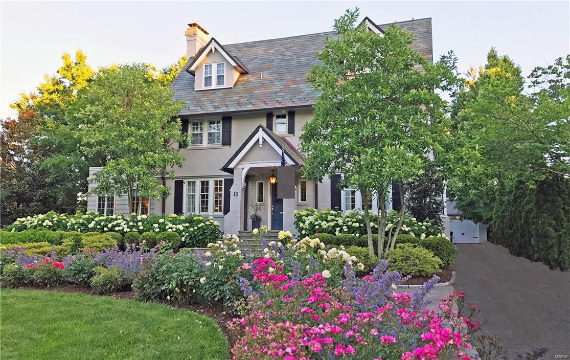Stately Tudor home sits on the finest private lane in Webster Groves, meticulously maintained & extensively restored by the present owners. New circular drive leads to a cascading bluestone front entrance & impeccably cared for grounds, offering peace & tranquility.  Superb millwork compliments handsome & stunning living spaces full of natural light.  Formal living room showcases a stunning fireplace & space for a Grand piano & opens to a light filled family room w/3 walls of casement windows. Guests may easily step out through French doors to the backyard patio & gardens. The 2nd floor has master, walk-in wardrobe, 2nd & 3rd BR, & 2 new full BA.  Third floor renovated w/built-in closets, 4th & 5th BR, & full BA.  Additional highlights: stained glass/leaded windows, chef's kitchen, striking hardwood floors, marble & solid surface countertops, elegant chandeliers, pocket doors, main FL powder room, irrigation system, new slate roof, & copper guttering. 3 car garage & carriage house.
