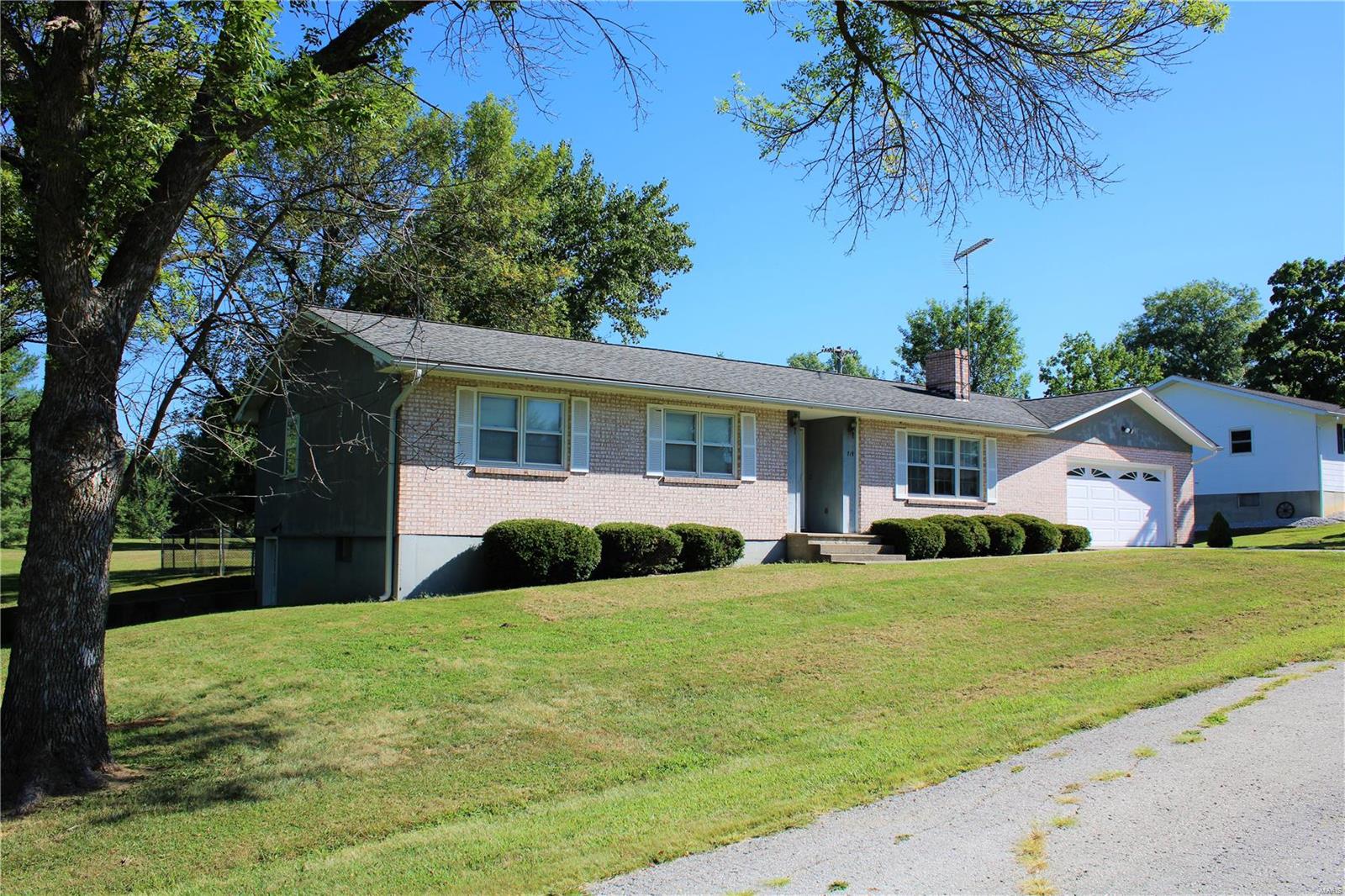 This ranch home is located in Paris, MO and it is with-in walking distance to the Paris schools! The home features four bedrooms, two bathrooms a large recreation room in the basement and a 5th non conforming bedroom. The main floor has a living room with a wood burning fireplace, a formal dining room and a main floor laundry room. The basement is partially finished and there is another wood burning fireplace in the rec/family room. There is a fenced-in back yard for your pets to roam and play freely. Sellers are selling the home in as-is where-is condition and will not make any further repairs. Great opportunity for a buyer to purchase a good size home and make it the way you want it!