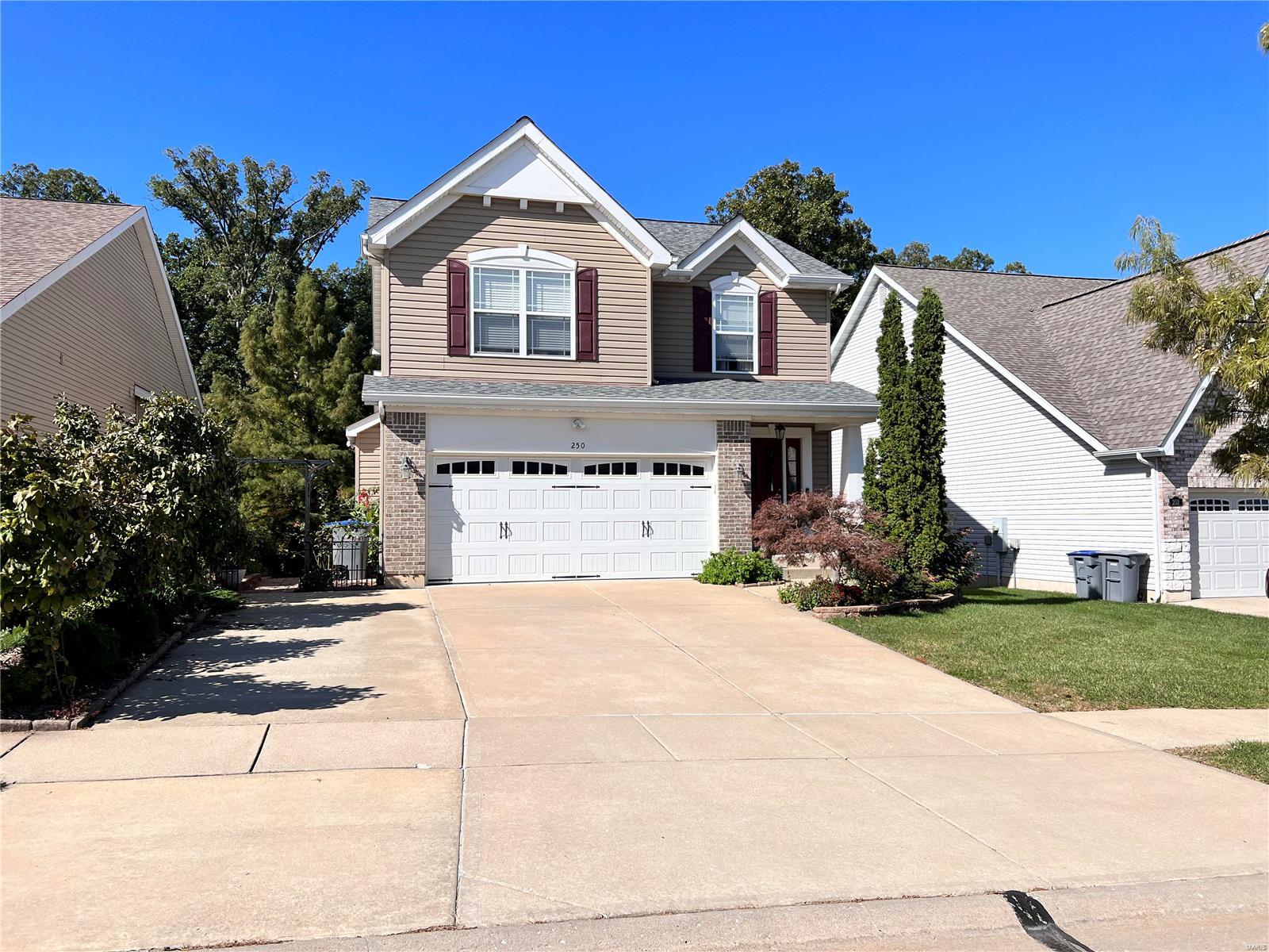 Adorable 1.5 Story home with 2 car garage and oversized driveway. Amazing great room with 2 story ceilings. Kitchen flows into the great room. New Luxury Vinyl Wide Plank Floors on entire Main Level. Main Floor Master Suite with Vanity, walk in shower + Walk in Closet. Walk Up Stunning Staircase with Rod Iron Spindles and New Carpeting. Upper level has 2 Bedrooms, Full Bath and Loft perfect for home office + New Carpet. Fresh Paint throughout the Main & Upper Level. Finished Walkout Lower Level with Family Room, Kitchenette, Electric Fireplace, Full Bath with Soaking Tub and Sleeping Room. Walkout lower level has covered Patio. Deck overlooks woods/trees perfect for privacy. Professional landscaping surrounds the home plus walkway from front to back. Low Maintenance exterior with Newer Roof, vinyl siding, soffits & fascia, gutter guards. Minutes from Alligator's Creek Aquatic Center. Main Floor Laundry.