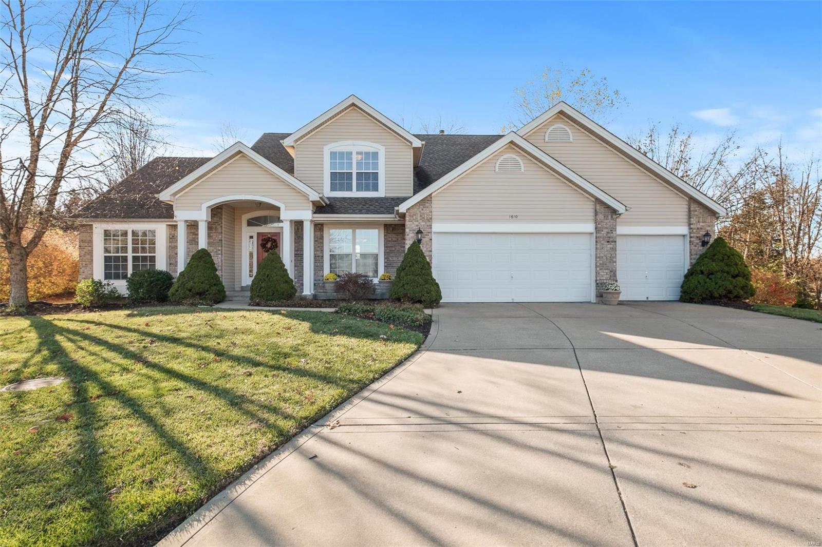 This stunning 1.5 story sits on the ideal lot! Lined with trees on all sides and at the end of a cul-de-sac, this home backs to Boulevard Park offering tons of privacy. Enjoy easy access to the park using the paved path on the other side of your yard. An oversized entryway and soaring ceilings greet you inside. The beautiful custom made brick-to-ceiling fireplace is sure to make an impression! Low-E windows allow tons of natural light while also protecting those beautiful hand scraped oak hardwood floors throughout the main level. The kitchen features a large island, granite countertops and over/under cabinet lighting. Main floor laundry and owner's suite for your convenience. Upstairs features all new carpet, a loft, 2 additional bedrooms and a full bath. The basement provides additional living space with a family room professionally wired for surround sound and another full bath. Addl features include: 3 car garage, invisible dog fence and inground sprinkler. Don't miss this one! Additional Rooms: Mud Room, Sun Room