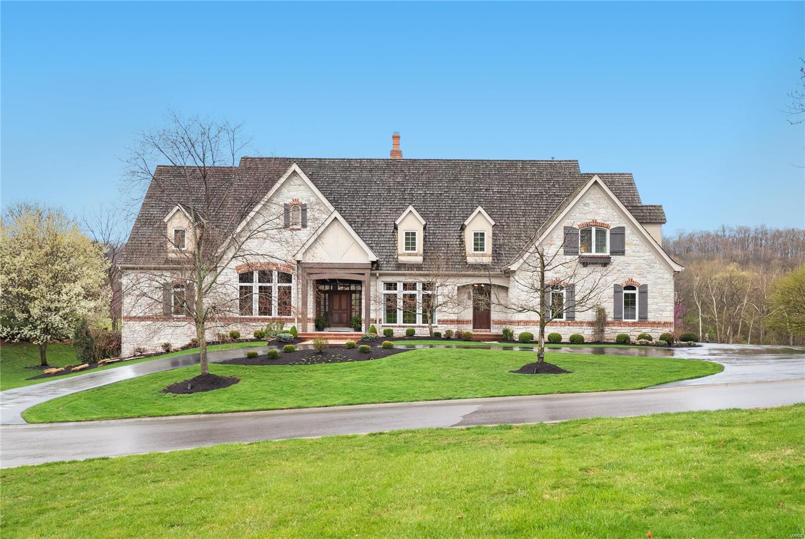 Magnificent Custom Stone Stunner. Your private swimming pool, deck & large stone patio enhance the panoramic golf course views that make this home feel like you're living in a resort. Your backyard w/putting green & fire pit add to the experience of living in St. Albans. Custom Millwork & numerous amenities including a new custom bar in the den, a gorgeous updated kitchen featuring an outstanding center island & Wolf & Subzero appliances. 4 newer HVAC Systems are controlled by Nest. Music system is Sonos. This is an all wired home run to unfinished part of lower level. 3 stone fireplaces w/gas logs. The garage is epoxy surfaced w/electric hookup for your Tesla. The 2 story Great Room has a full stone wall fireplace & built-ins. Main floor bedroom has a luxury bath & huge custom finished walk-in closet. Finished walk-out LL features exercise room, rec room, game room, media room, office, full bedroom (currently seller's pottery studio) & bath. Attention to detail throughout!