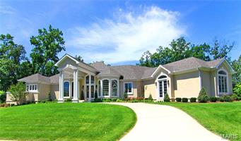 From the moment you drive up the circle drive & pull under the "Porte Cochere" and enter the foyer you can feel the difference with this home. High ceilings & windows along every wall capture you right away. The kitchen & living area are the true heart of this home. Custom cabinetry & viking appliances with prep island & wrap around breakfast bar. Wall of windows and doors draw you to the outdoor pool space & Lanai that makes you feels like your own resort.  Pool area is an entertainers dream w/ tree lined privacy, travertine tile floors with a bar & grill area. Master suite wing with his & her closets & vanities, fireplace, steam shower & french doors that open to the pool. Basement w/ theater area, family room, game room, space for a work-out room & wine room.This stunner is over 7,400 sq ft & perfectly tucked into 1.5 acres with woods creating a secluded & private feel right in the heart of town. Every detail is thought out and there is more! Additional amenity list is available.