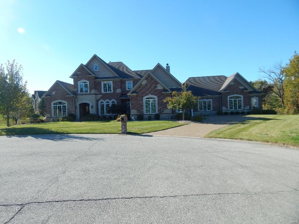 Listing agent must be present for showings to your preapproved buyer
This magnificent custom-built 1.5 Sty features over 7400 sf of living space enhanced by exceptional craftsmanship & contemporary amenities throughout! 2-Sty marble foyer welcomes you home. A delicious gourmet open kitchen with gorgeous granite, custom cabinetry, Center Island, and fireplace is great for entertaining. Main Floor Master suite has fireplace, walk in closets and a Luxury master bath with dual vanities, Jacuzzi tub and large custom shower. Upstairs has 3 bedrooms with there own private bathrooms, walk in closets and custom built ins. Lower level offers a master suite along with game room, workout room, wet bar, and basketball court. This home is located in a private gated community. Must see this home to see all its amenities.