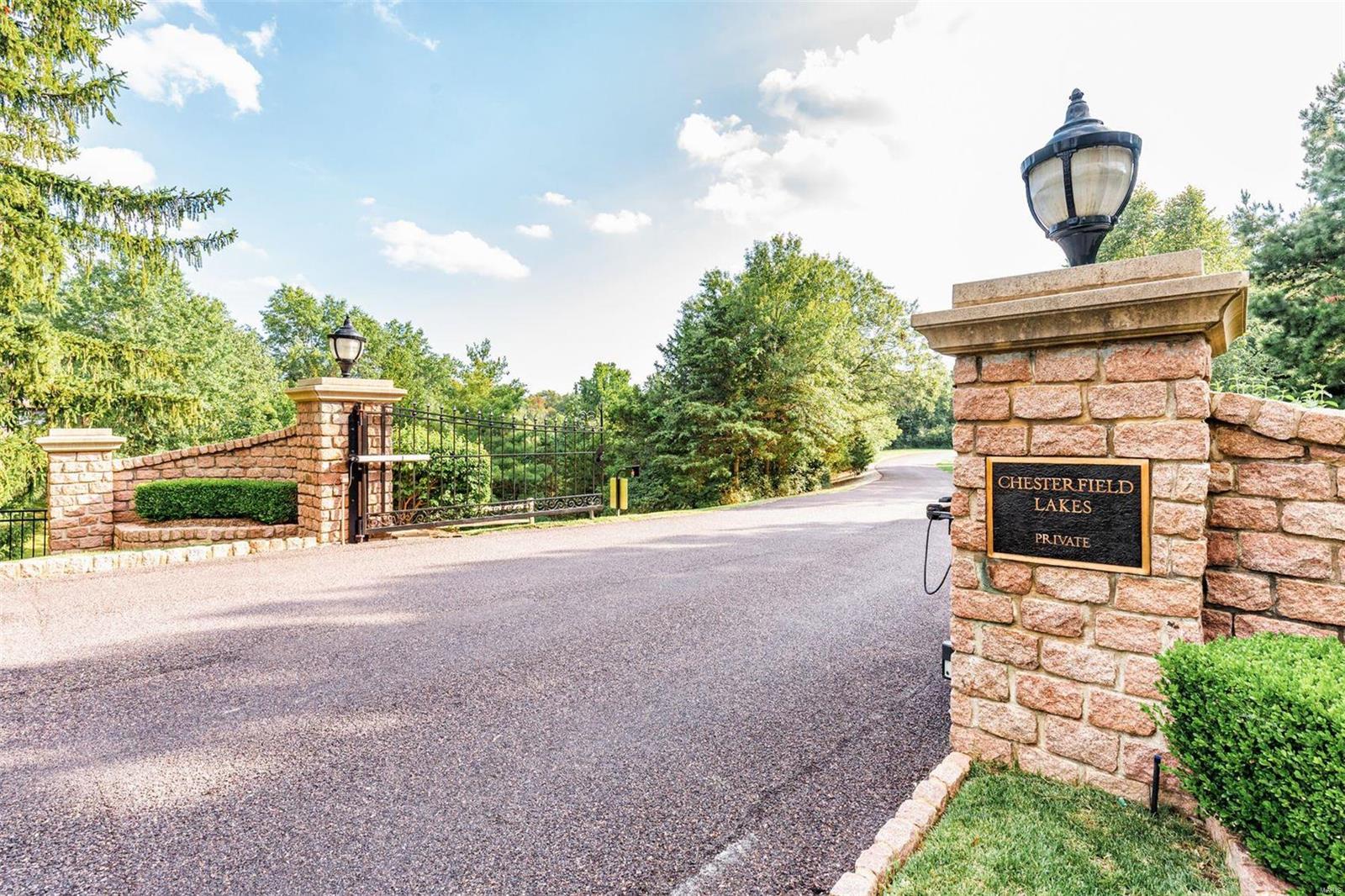Luxury lakefront property on 3.3 acres in the heart of Chesterfield!  You will feel like you're on vacation every day! Beautifully landscaped with a gorgeous 14 acre private lake where you can swim, fish, kayak, & paddleboard. This multilevel contemporary has amazing scenic views of property & lake. Enjoy all the views from newer floor-to-ceiling windows and 4 updated decks.  Beautiful marble floors and fireplace surrounds. Entire home has been updated including flooring, windows, wall paint, & 3 car garage. Enjoy the tranquil sounds of the waterfall that leads you down to the lakefront patio, firepit, & pavilion with electrical outlets. Incredible master suite with adjoining sitting room & updated luxury master bath with skylight.  Finished walkout lower level with bedroom suite, full bath, recreation room, and storage room. Items excluded: garden memorial plaque, stepping stones, lion head on master porch, silver & black statue, & dining room chandelier.