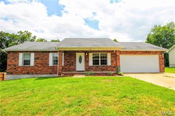 Priced to sell. This is a gorgeous 3 bedroom, 2 bath home located in a wonderful subdivision in Waynesville. The living room is extremely spacious and features a beautiful brick gas fireplace. There is an awesome laundry/mud room right off the garage. You'll find gorgeous wood laminate floors in parts of the home and carpet in the bedrooms. All of the bedrooms are large and the master bedroom has a large walk in closet and a master bathroom suite which features a double vanity, and a tub/shower combo. There is a covered porch in the front of the home, a large deck off the back of the home, and a spacious flat yard! Give us a call today to view this home! Seller is offering up to $445 of American Home Shield Warranty!