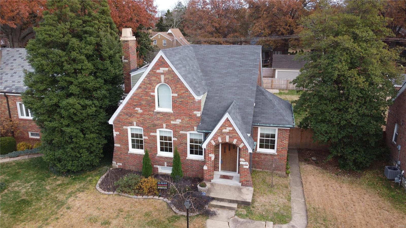 Walk to Carondolet Park! This brick home was built in 1930 and recently renovated to meet the needs of today's busy families while still keeping the historic charm. The entry way opens into a large living room with floor to ceiling stone wall gas fireplace. Make your way into the beautifully renovated kitchen with granite counter tops, unique wood shelves, and stainless steel appliances. This home features a main floor laundry and MAIN FLOOR MASTER SUITE with ship lap walls, walk-in closet, and large bath featuring heated floors! Check out the unique guest bathroom with patterned floor tile and beautiful lighting original to the home.Head upstairs to see two very large bedrooms and additional full bath. Do you love to entertain? Head down to the finished basement perfect for projector/theater, small office, or even a workout area. The basement also has a half bath, plenty of storage, and walk out to the large backyard. A 2 car garage finishes this stunning home.