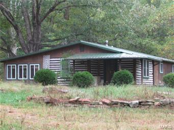 Great Recreational Retreat or Homestead Property! This property joins the National Forest on 2 sides and has Courtois Creek frontage. Water and electric in the barn and shop.  The shop includes heating, cooling and a kitchen.  There is a stocked pond, 12x8 playhouse and a 12x16 treehouse.  The barn includes 6 stalls, tack room, heated waterer and corral. Approximately 1/3 of property is fenced and there is a great garden spot.  The home has an updated kitchen and bathrooms.  The master bedroom includes a walk- in closet, a full bathroom and access to the 13x24 covered deck.  This property is very close to Berryman Trail and Ozark Trail and has an abundance of wild life and trails throughout.