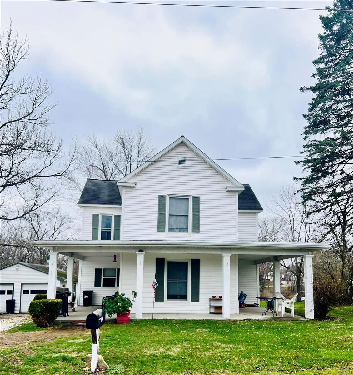 This Charming home has a beautiful wrap around porch to soak up the summer nights. 4 Beds, 2 Baths. 9 foot ceilings on the main floor with Main Floor Laundry, a remodeled Kitchen in 2021, new hot water heater, dishwasher and microwave all in 2021. New laminate wood flooring 2022. New paint in most of the house 2021/22. There is also a 2 car detached garage with an additional workshop inside. Don’t miss out on this unique piece of history that had a face lift. Bring Back-Up Offers!!