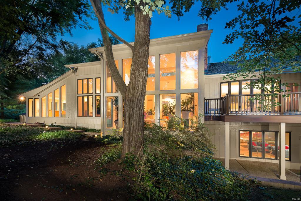 Handsomely designed and constructed contemporary jewel is inspired by the unique private setting minutes from shops and restaurants. A classic blend of wood, brick and floor to ceiling windows work in combination with beautifully renovated baths and kitchen, adding a sense of luxury to the modern aesthetic. Custom cabinetry and floor to ceiling marble fireplaces along with rich design elements add texture and style and a sense of warmth to the elegant clean lines of this home. Spaces are open with dramatic high ceilings, wonderful light and flexible living. The pool area is gorgeous and the lot is a beautifully landscaped acre plus. Every surface has been lovingly updated and is totally current. Don't miss this rare opportunity.