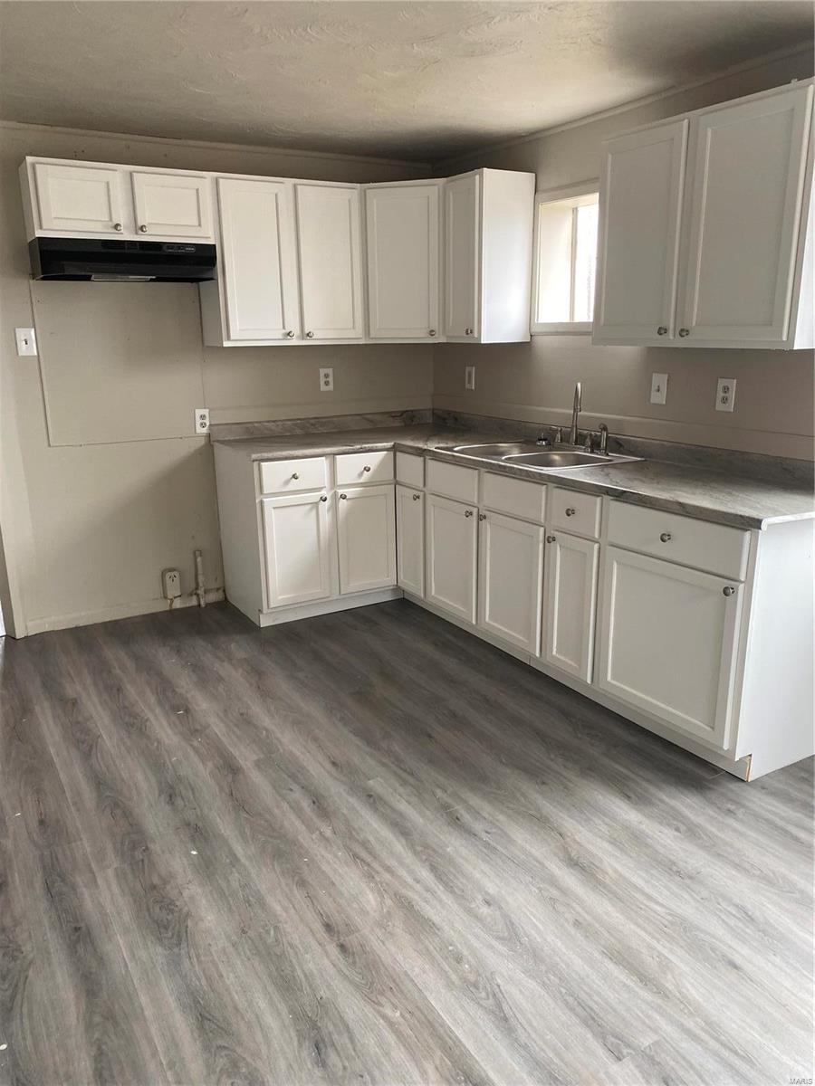 Overland opportunity awaits!  Renovated 2 bed 1 bath with basement.  New vinyl windows, new paint, all new vinyl plank flooring throughout.  New kitchen cabinets, countertop, faucet, exhaust fan.  New vanity in bathroom.  New roof replaced about a month ago with Architectural shingles. Newer water heater.
Some repairs needed on exterior but great starter home or investment property.  Tuckpointing recently done at chimney and right side of house.  Please write offer on Special Sales Contract.