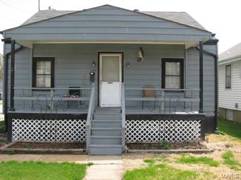 840 sq ft home & massive approx 2000 sq ft garage that was formerly a grocery store.  The garage has sink, commode, furnace, ac, present owner never used. Both buildings have newer roofs. There is a 3rd garage with about 400 sq ft also. The home was built in 1930, 4 rooms, bath & small kitchen. An attic, basement with new paint and new electric panel box. The bedrooms have new paint and carpet, blinds on the windows, ceiling fan in each room but bathroom. Wood parquet flooring, newer hot water tank, washer and dryer hook up in basement. Fenced yard. Small yard and garden spot.  Three blocks from Katy Trail and Missouri River, boat ramp, antique shops and car repair.