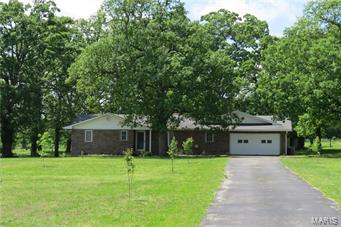 STUNNING 4 bedroom 3 bathroom home on 1.25 acres just north of town. This spacious home features over 2100sf of beautifully remodeled living space and includes features like hardwood floors, a wood burning fireplace in the living room and a large family room. The home has the open concept floorplan that makes it super easy to entertain family and friends, AND it offers a split bedroom floorplan as well, with the 3 guest bedrooms and the fully remodeled main bath on one side of the house and the master suite on the other. 1 of the 3 guest bedrooms has a full bath attached, and the master suite is wonderfully appointed with a spacious walk in closet and a beautiful full bathroom! The kitchen is a chef's dream with granite countertops, custom solid wood cabinets and stainless steel appliances. Through the french doors of the family room is an oversized deck allowing for maximum entertaining space for BBQ's or family gatherings. This home is COMPLETELY UPDATED and is MOVE IN READY!