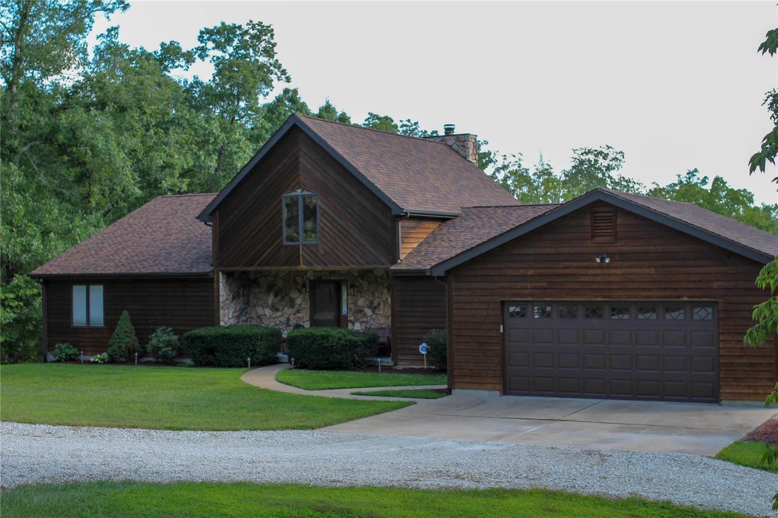 A MUST SEE!STUNNING,CUSTOM HOME/PROPERTY/LARGE SHOP on 20+ acres in St Clair. Located approx 5 min from Hwy 44.This home was custom built,has gorgeous wood interior doors & trim,wood Pella windows and doors, very well maintained and a one time owner with no pets or kids living in home.The great room offers a BEAUTIFUL, stone, wood burning fireplace that goes the full height of the vaulted ceiling.The loft area is open to the great room with many views out of the LARGE windows throughout the rear of the home with stunning views.The kitchen has wood cabinets, breakfast area with large bay window & sliding door that walks out to the amazing deck that extends across the whole back of the house. Main floor master suite also walks out to a screened in area of the deck overlooking the wooded lot. Lower level is fully finished with custom wet bar area, wood working area, bedroom, bathroom, entertaining area and a walk out that goes to covered patio.CALL TODAY FOR PRIVATE SHOWING. COOL: 14 SEER+