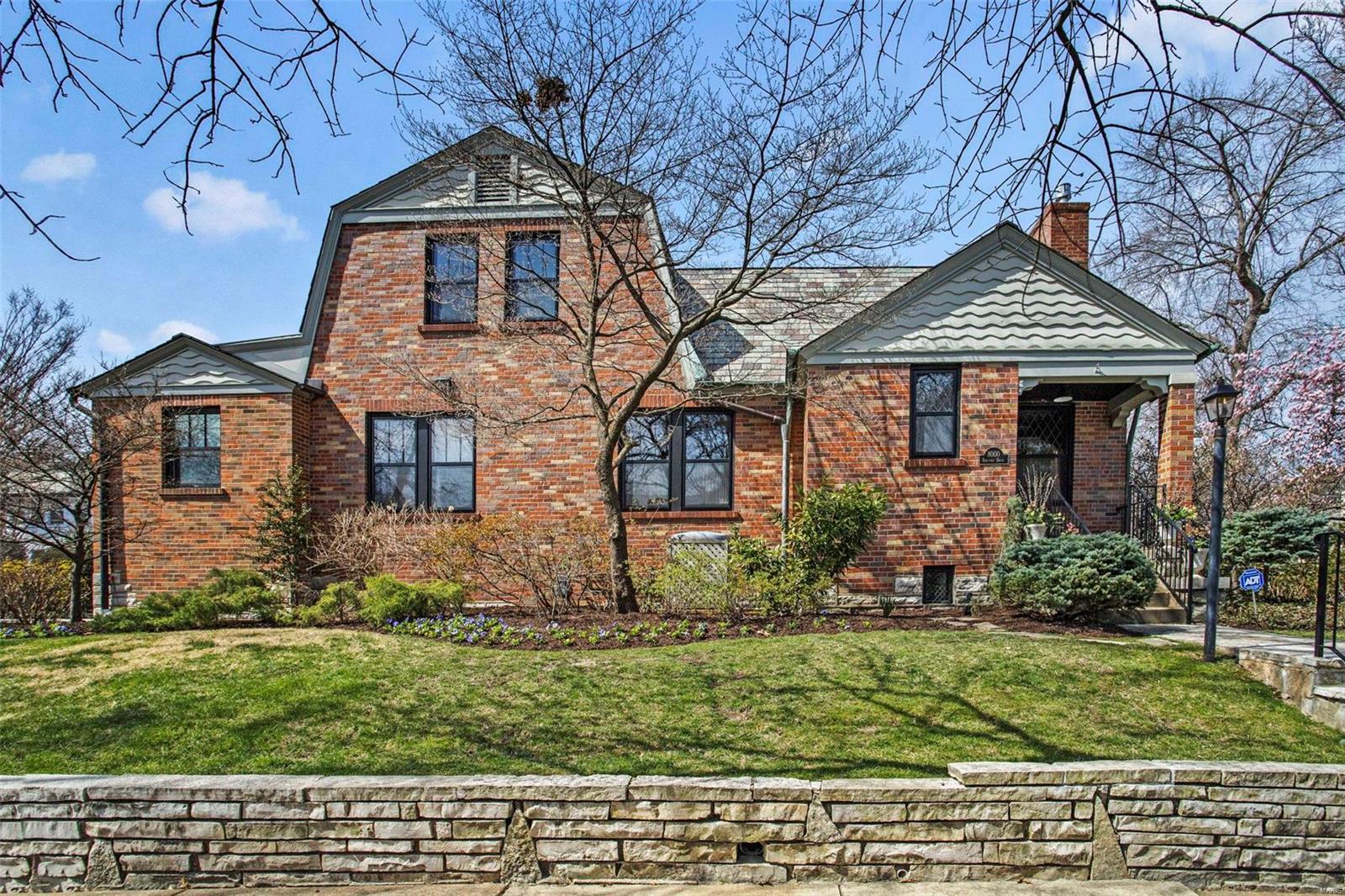 Price Drop!!! 8000 Venetian, just steps away from EVERYTHING Clayton has to offer. A 2 block walk to Meramec Elementary School, a short walk to downtown Clayton, Shaw Park, restaurants/shopping. This thoughtfully updated 5-bedroom, 3.5 bath, two story features hardwood floors, enormous kitchen with large island, granite counters, induction cooktop (2020), double ovens, first floor laundry/mud room, and finished lower level with ½ bath. Upstairs, find the master suite featuring His and Her large closets/extra storage. The master bath boasts: Heated floor, heated towel bars, jetted tub, double basins. Note the care taken to preserve woodwork including the distinctive Magic wood doors. The oversized garage has a workshop area. Outside features a gated stone patio,  and sprinkler system.  The professionally landscaped yard has mature trees, and well maintained retaining wall around the yard. The side yard (Venetian side) and the rear can be dog run and or play area. Slate covers the roof!