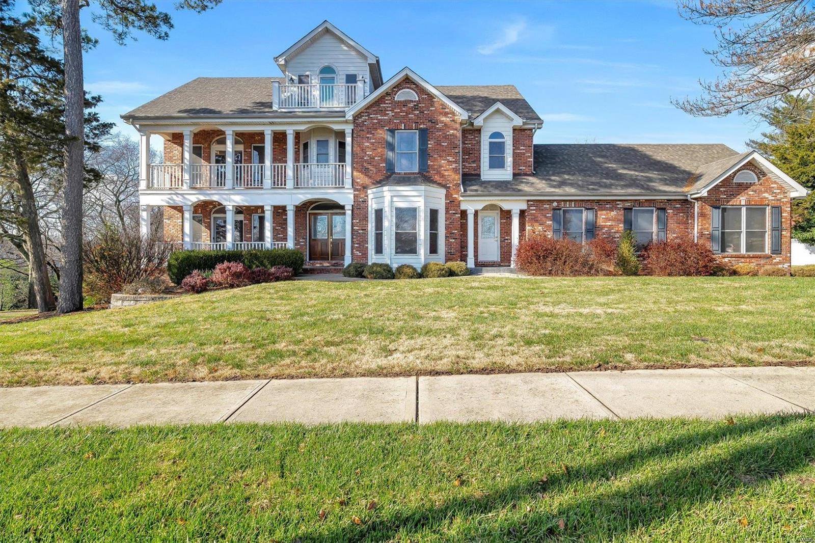 Stunning estate w/ a million dollar view! On nearly half an acre, this 3 story custom built home w/ 95% brick, 3 car rear entry garage, covered porch & balcony give this home excellent curb appeal! As you enter this home you are greeted with 9' ceilings throughout, crown molding, solid oak 6 panel doors & trim & tons of picture windows allowing for plenty of natural lighting in this approx 5,000 sq ft, 4 level home. The kitchen offers white 42" cabinetry, stainless steel appliances, center island & an adjoining breakfast room w/ access to the deck overlooking the backyard. The primary suite boasts vaulted ceiling & access to your own private balcony as well as luxury bath w/ double sink, shower & large tub! Make your way up to the 3rd level loft w/ balcony & stunning view of the river! Additional amenities include finished walkout lower level, laundry available on the 1st floor & lower level. Furnaces were replaced in 2016 & 2018. Newer roof - 2017, newer carpet & vinyl floors - 2019