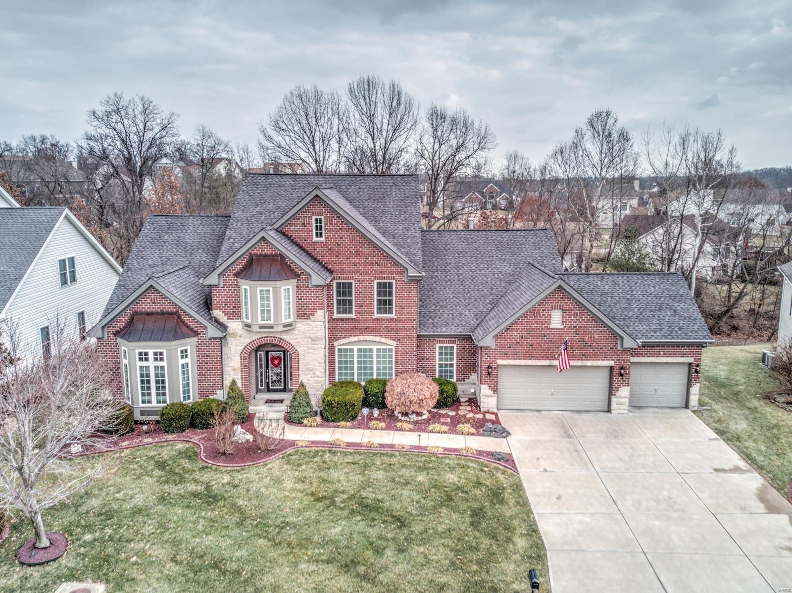 Beautiful 1.5 story home on a quiet cul-de-sac. Private lot backing woods. Premium brick and stone elevation. Two story entry foyer. Gourmet kitchen with granite countertops, upgraded cabinetry, center island, Thermador gas cooktop, dual wall ovens, and wine cooler. Floor to ceiling brick & stone see-through gas fireplace. Formal dining room with tray ceiling. Front office with built-ins. Luxury master suite with two walk-in closets and soaking tub. Finished walk-out lower level with wet bar, double sided gas fireplace, billiard area, surround sound media room, tray ceiling, and patio. Hardwood floors. Jack and Jill bathroom. Picture windows. Whole house speaker system with components and 26 built-in speakers ($26,000 cost). Large deck. Professional landscaping with in-ground sprinkler system. Finished three car garage. Ceiling fans. Crown molding. Security system. Main level laundry room. No children. No pets. No smoking. Furniture, appliances, rugs, and decor are negotiable.
