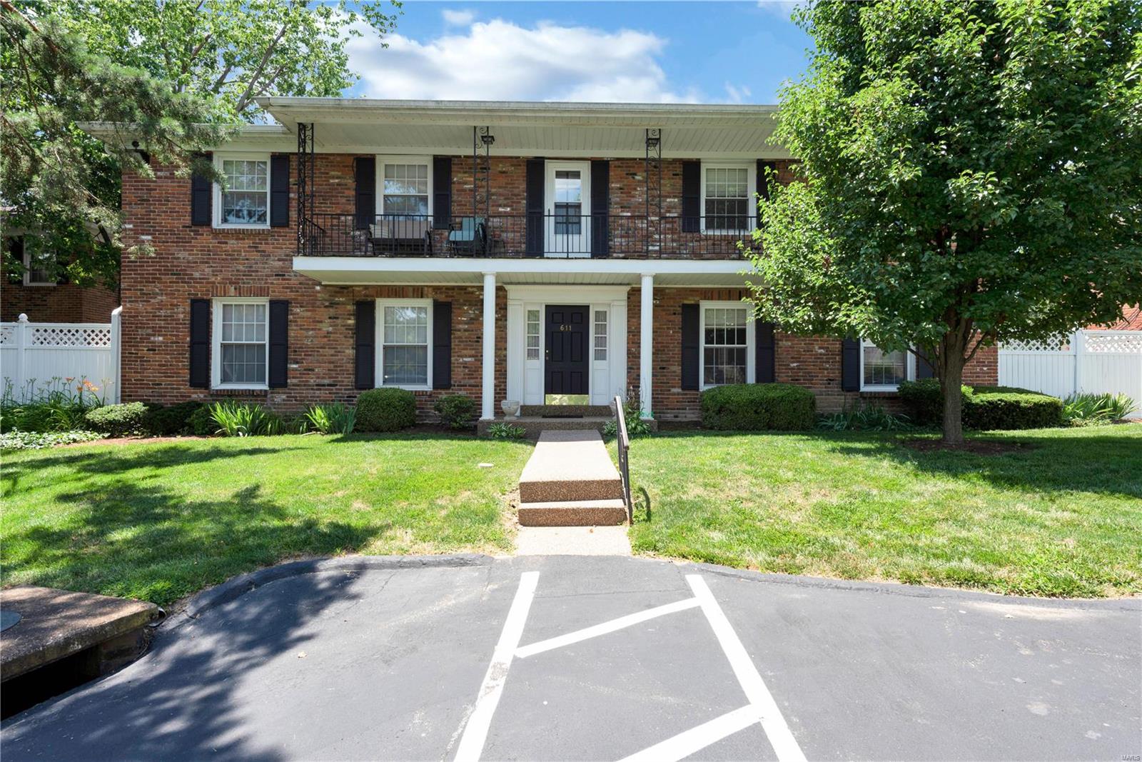 Just a few blocks away from Downtown Kirkwood this beautiful 2 bedroom/1 bath condo on the second floor with one car attached garage is a must see. Entering the condo you are welcomed in the spacious living room that opens to the kitchen and dining room.  The two bedrooms are nicely sized with good size closets and 1 full hall bath.  Walk out the front door and enjoy the front balcony.  Downstairs to the basement the condo has a private laundry area in the large private storage space. The home is walking distance to Downtown Kirkwood, Magic House and Kirkwood Park.  Close to shops, restaurants and highways too.  You don’t want to miss this cute condo in the heart of Kirkwood! Location: Corner Location, Upper Level