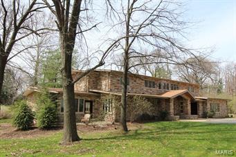 Completely renovated & expanded Mid Century modern home is nestled on almost an acre on  private Ladue st.
Meticulous attention to detail is pervasive with artisan quality materials & the highest quality finishes.
Gorgeous Brazilian mahogany handcrafted doors, cherry hardwood flooring, stucco wall treatments &natural stone
are found throughout this residence. Main fl master suite plus 4 upstairs bedrooms are completely renovated with new baths, built in closet organizers & newer windows. 
The gourmet chef will be delighted, kitchen selections featuring Wolf cook top, pot filling faucet,Wolf double oven & hood. 2 sinks, Sub Zero refrig & Miele d/w. Leather honed finish on the granite counters. 
Fabulous outdoor space incl a 7 yr old  salt water pool, covered patio w/ Italian tile surfaces & ceiling fans. Thoughtful landscaping design to maximize privacy and enhance views.  Huge bonus room!! Flexible space over the garage may be used as an office, studio with a full bath.