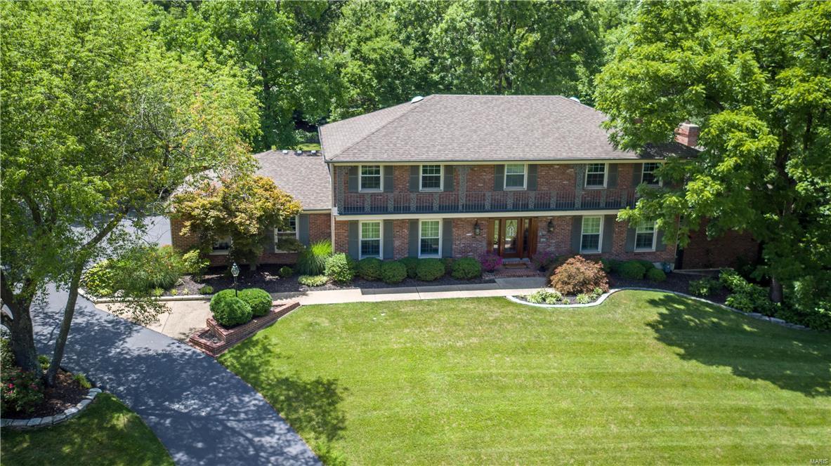 A rare opportunity in Berkley Manor! This 1.5-Sty brick home on sits on .72 acres is understated from the street. Inviting entry foyer opens to formal living rm & elegant dining rm w elaborate mill work & spacious family rm w wood beamed ceiling, rich paneled walls, built in bookcases & wood burning fireplace. The updated kitchen features custom cabinetry, granite counter-tops, premium appliances & center island & breakfast bar adjoins breakfast rm w vaulted ceilings, butler's pantry, wet bar, private office w built in bookcases. The main fl. master bedrm suite has vaulted ceilings w oversized walk in closet, & lavish bath w shower spa & Ultra tub for 2 offers an appealing retreat. 2nd flr extends the living quarters w a bedrm suite & 5 additional bedrms & a bath. Walk-out Lower Level includes recreation rm, family rm w fabulous wet bar and a fireplace, workout rm, and a full bath & lg storage rm. Walk out any set of French drs to enjoy your private backyard and patio area.