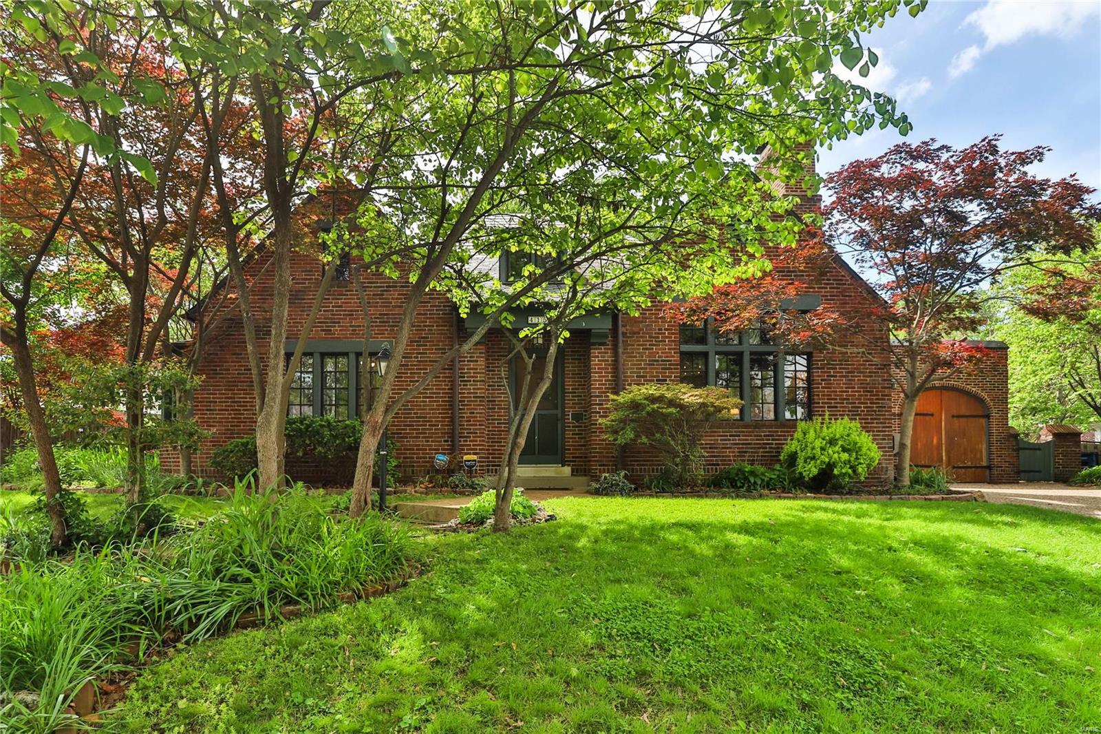 Welcome to 415 Alta Dena Court, an exciting Maritz and Young gem in move-in condition and set in a delightful cul-de-sac. The Tudor living room and dining room are showstoppers! 2 bedrooms on first floor, 1 bedroom on second with another room that could be a nursery or office. Full baths on each floor. Fantastic storage space throughout. Beautiful plantings surround the 4 season room which leads out to a serene patio. 2 car attached garage with electric door openers. Sellers had no intention of moving so soon after their purchase, but family needs are calling them out of town. Brand new high efficiency hvac in April 2024; sellers also made made roof repairs, put quartz countertops in kitchen, painted, and added FIRST FLOOR LAUNDRY!  Would be a great condo alternative, just minutes away from the Loop and downtown Clayton. Some Accessible Features