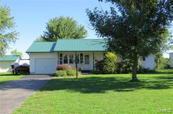 This 3 bedroom 2 bathroom home is nestled on a beautiful 1 acre lot just outside of the Lebanon city limits on a quiet street. The home features a front living room (currently being used as a formal dining room), an eat in kitchen with loads of cabinet and counter top space, updated appliances and laminate wood flooring, a spacious family room which opens up onto a nice sun room with heat and air. There are 2 guest rooms, each with large closets, and a master suite with a walk in closet and a full bath. There is a large single car attached garage as well as a singe car detached garage/workshop, and 2 storage sheds outside, PLUS additional parking spots for cars, boats or an RV! The lot is gorgeous! It offers mature trees and landscaping, a garden spot, and partial fencing...and the backyard is perfect for entertaining or just relaxing in your hammock and reading a good book. The home has a new steel roof, updated flooring, fresh paint, and much more - CALL TO TODAY TO SCHEDULE A TOUR! Additional Rooms: Sun Room