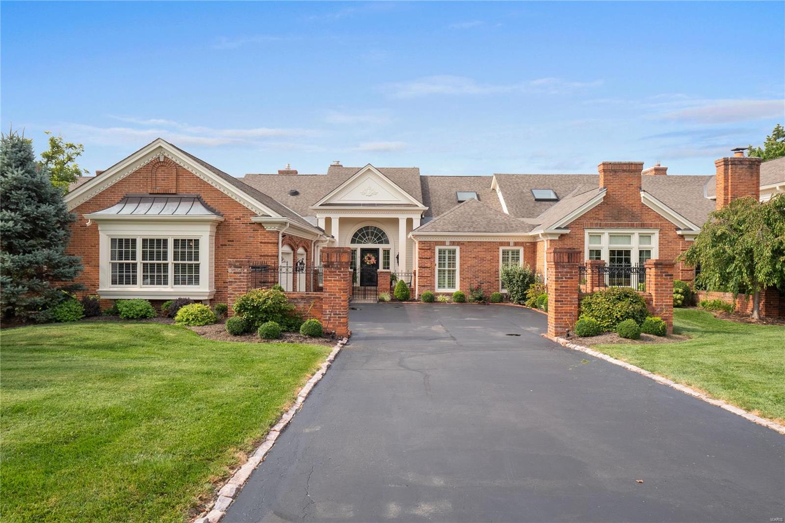 Stunning Villa in Woodbridge Manor that has been beautifully remodeled!! Every room is appointed with amazing woodwork, light fixtures, window coverings, and was features in Sophisticated Living (Mar/Apr 2022). Walk through the light filled foyer that leads to a massive great room with amazing mill-work, gas fireplace, and large doors overlooking the expansive yard and brick patio with built in BBQ. The family room is wood paneled with a gas fireplace, wet bar, built-in's, and bay window. Off the Great Room is a large Dining Room perfect for entertaining. Custom kitchen has a Wolf gas cooktop, Subzero, large island, and plenty of storage which opens to the breakfast room/den. The Master Suite also overlooks the gorgeous backyard and has an amazing custom closet and large bathroom. The Lower Level is vast with over 2,000 square feet of livable space with bar, full bathroom, wine room, office, third bedroom, and tons of additional storage. Location: End Unit