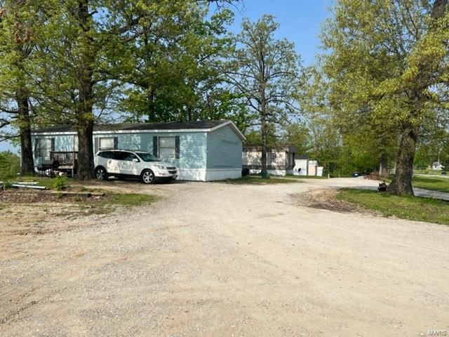 Please do not disturb tenants! No showings. Great add on value here! 6 occupied manufactured homes currently bringing in $4,175 per month. Up to 17 other manufactured homes can be added! Roughly 5k to hook into utility services per lot, plus physical install / lot dev. costs. Tenants pay separate electric, sewer and water. Owner pays trash (one dumpster) and electric for grinder pump. Unrestricted Lincoln county. No viewings until after a contract is agreed to. The 3 singlewides in corner will be moved off before closing.