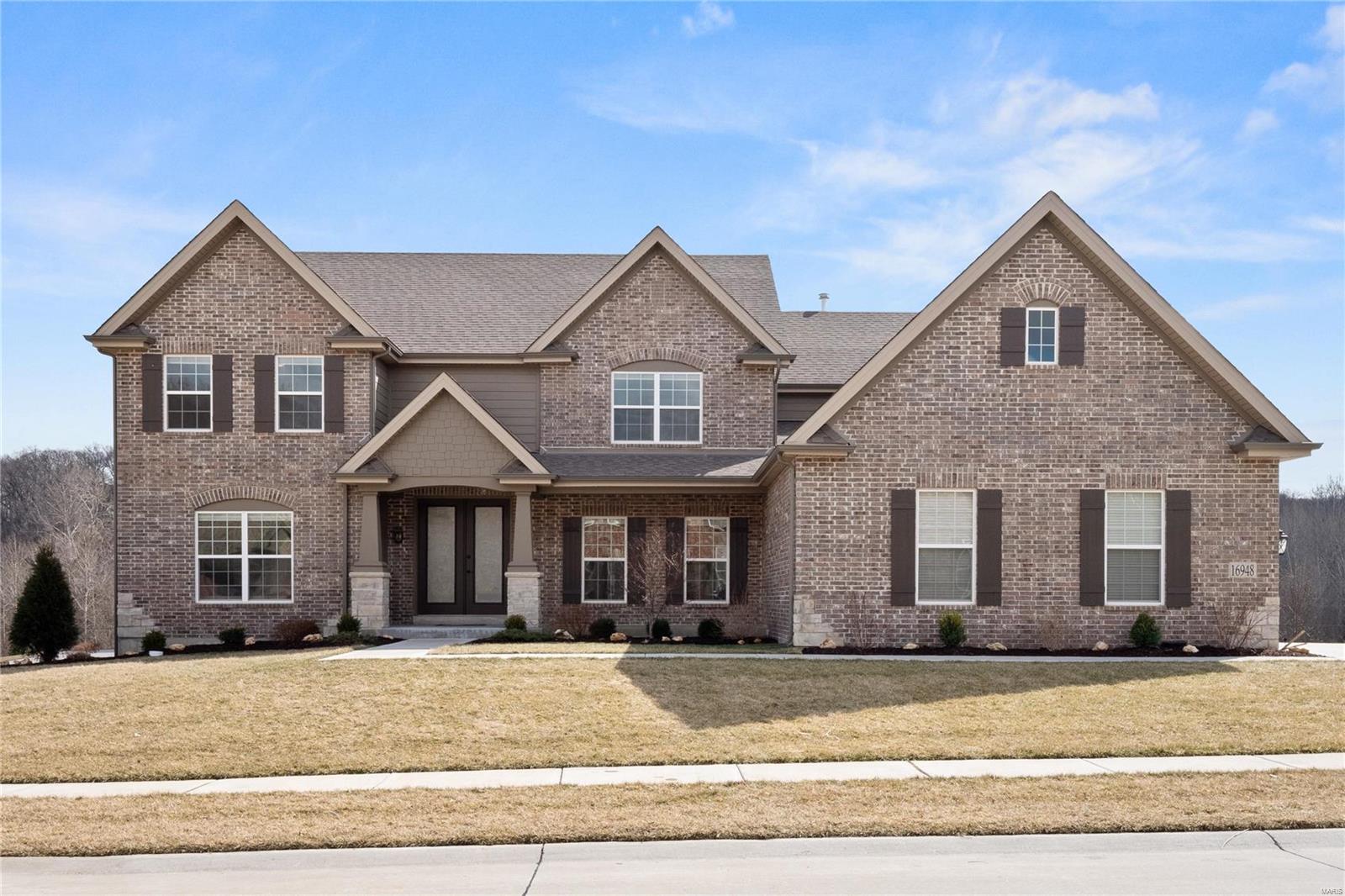 Why wait to build!! This beautifully-crafted custom home is situated on a picturesque, .5 acre lot. The moment you step through the front door, you'll be impressed w/ the quality & detail at every turn. The hardwood flooring, warm decor, upgraded lighting package, & spacious open floor plan are sure to WOW! The Gourmet Kitchen features granite counter tops, stainless steel appliances, center island, & sophisticated Marble Back Splash..leading to the bright sunny hearth room. The 1st floor offers a beautiful two story great room, overlooking the beautiful view & fireplace. The generous main floor Master Bedroom Suite has a large, walk-in closet, & a spa-like bathroom with his & her vanities. Upstairs features an Expansive Bonus Room & 3 additional, spacious bedrooms. The Finished Lower Level is perfect for additional entertaining & features a rec area & 5th bedroom. Over-Sized three car garage w/ side entry, professionally landscaped w/ sprinkler system complete this beautiful property. Additional Rooms: Sun Room