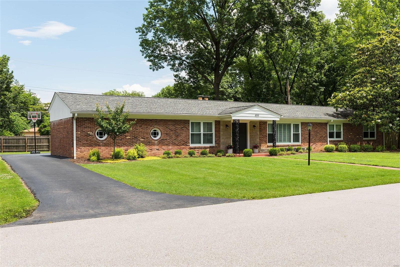 Located in the top-rated Ladue School District is this impeccable ranch home with over 3,500 square feet of living space. The main living area is open and bright with hardwood floors throughout. Formal dining room and living room. The kitchen features a peninsula island, granite counters, and custom cabinets. The family room is open to the kitchen and includes a fireplace and doors that lead to the back patio & level, fenced backyard.  The primary bedroom is lovely with an en-suite bathroom. The main level includes 3 more bedrooms and a newly updated bathroom. The lower level was recently finished and includes a large recreation area, tons of storage, a full bath, an egress window, and room to add an additional bedroom. Close to Clayton. 2-car rear entry garage.