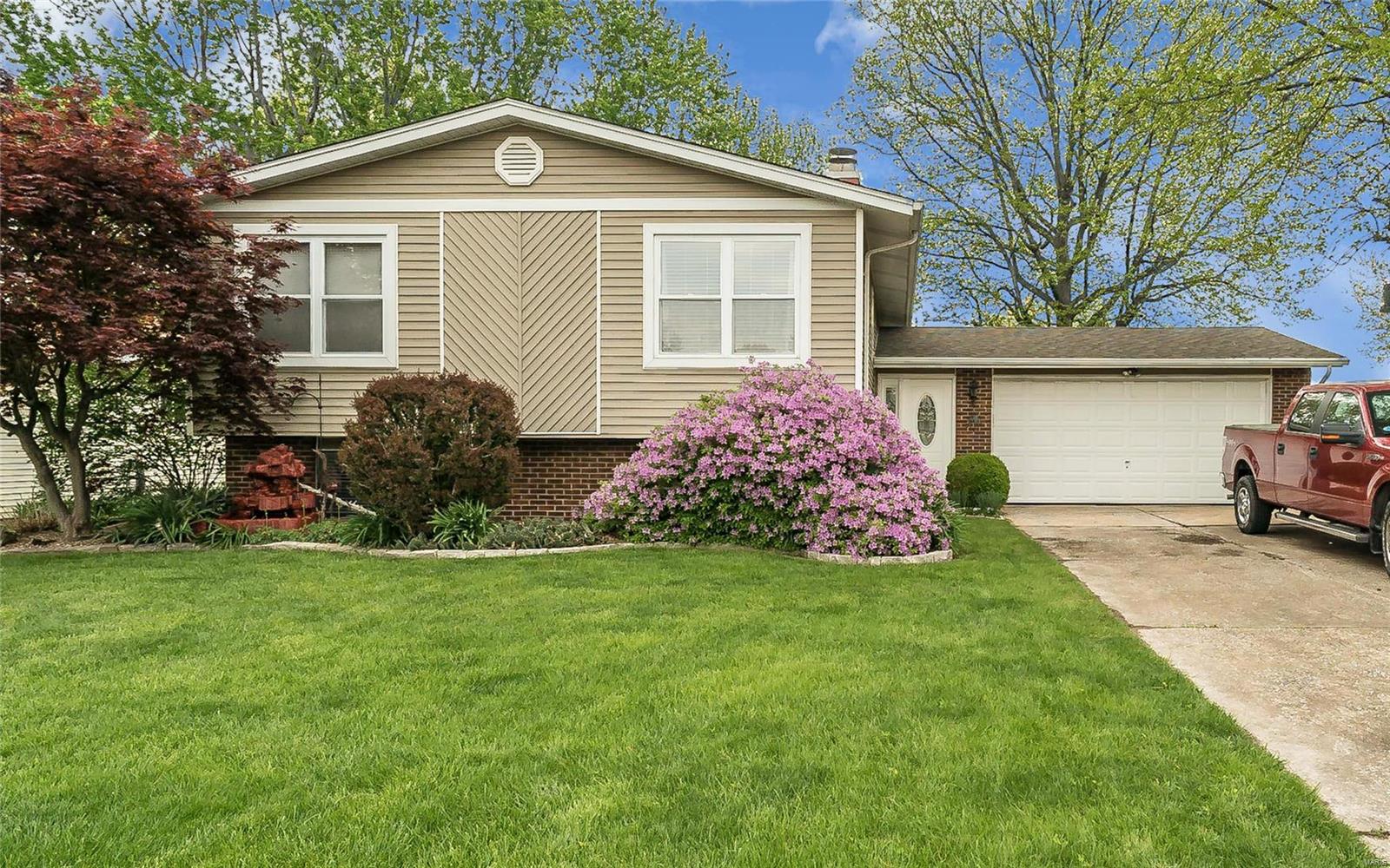 This well maintained home in the Heart of St. Peters shows pride of ownership! You'll feel like you're in your own private oasis with the beautifully manicured lawn and abundance of established trees and flowering bushes. The entry foyer greets you with a porcelain tile floor and a freshly painted interior along with all new flooring on the main level. Tons of updates, new can lighting in the living room, new back splash in the kitchen, both full baths have been updated and one features a jet tub. Enjoy relaxing on the large deck overlooking a lush green lawn. This home has so much to offer, you'll want to call it Home! Seller is a licensed agent.