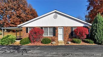 Very nice and conveniently located 2 bedroom condominium! This spacious 2 bedroom condo features large kitchen with glass tile back splash, pantry and breakfast bar. Stove & refrigerator STAYS. Living room with updated ceiling fan. large laundry room with lots of storage area. Home offers 6 panel doors, newer light fixtures, garage door & garage door opener. New roof in 2017. Bathroom, laundry, furnace room and hallway have beautiful concrete epoxy floors. 1 car garage with pull down for added storage. Covered carport and patio. CONDO IS GROUND LEVEL! Assoc fees are paid quarterly covering landscaping, lawn & snow removal & some insurance. This property cannot be rented.  Easy to show, make your appointment today!