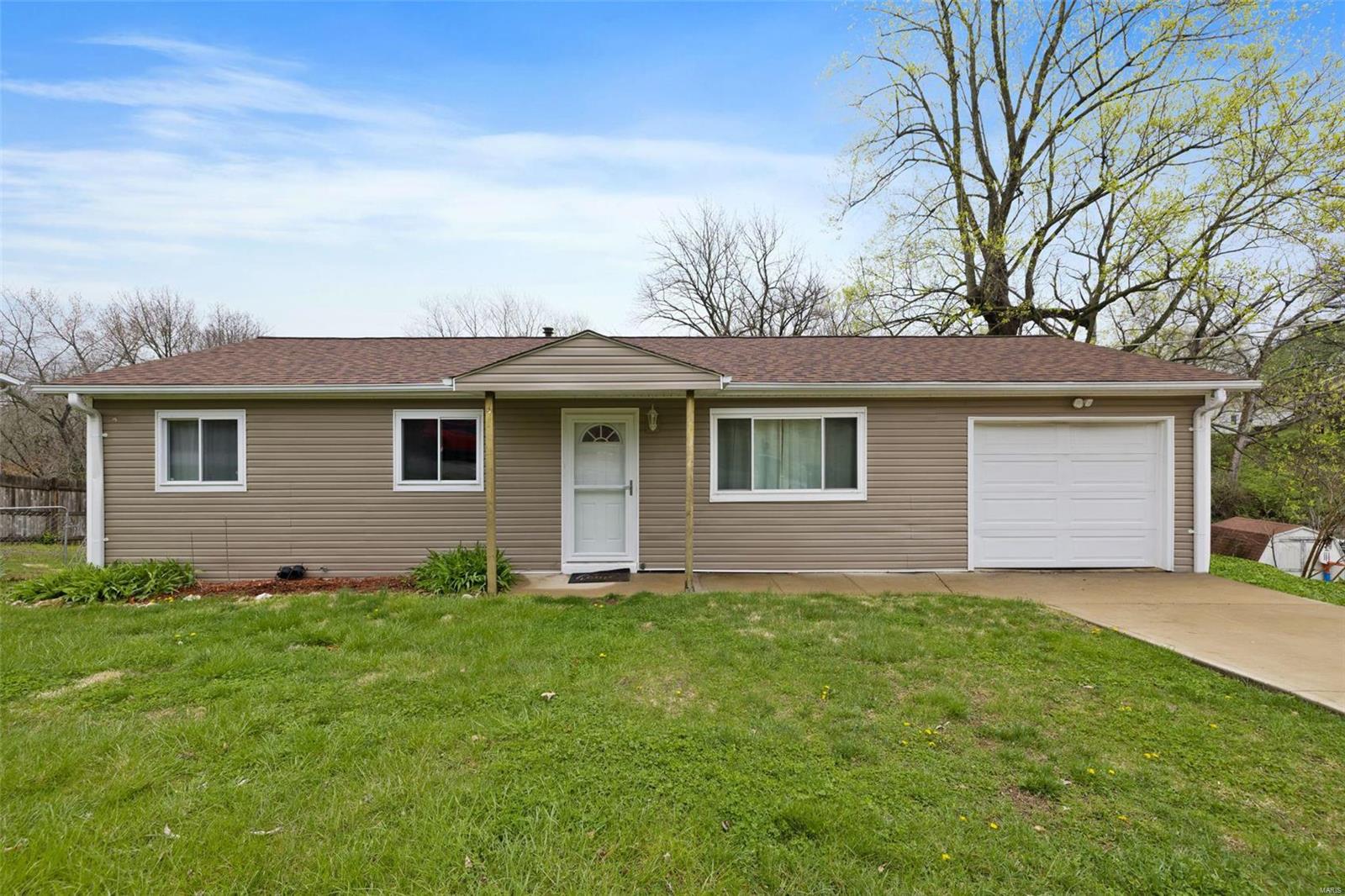4 bed, 1.5 bath Ranch home on a quiet street has lots of room to grow! The main floor features a bright living room, 3 bedrooms, a full bathroom, and a kitchen that has access to the deck over looking a large fenced backyard. Downstairs you will find a finished walk out basement with rec room, large bedroom, half bath, laundry, and a nice size storage area. There is a 1 car garage and additional parking adjacent to driveway. This home is located in Northwest schools and is in a great High Ridge location just minutes to nearby shopping and entertainment at Gravois Bluffs. Home is being sold in as is condition and is ready for you to make your own updates!