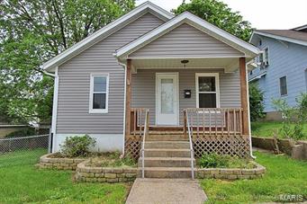 New v. windows, vinyl siding, updated electric, front porch and a fenced yard are a few amenities this adorable 2 bedroom home with a walk out basement offer.  Don't rent when you can buy!