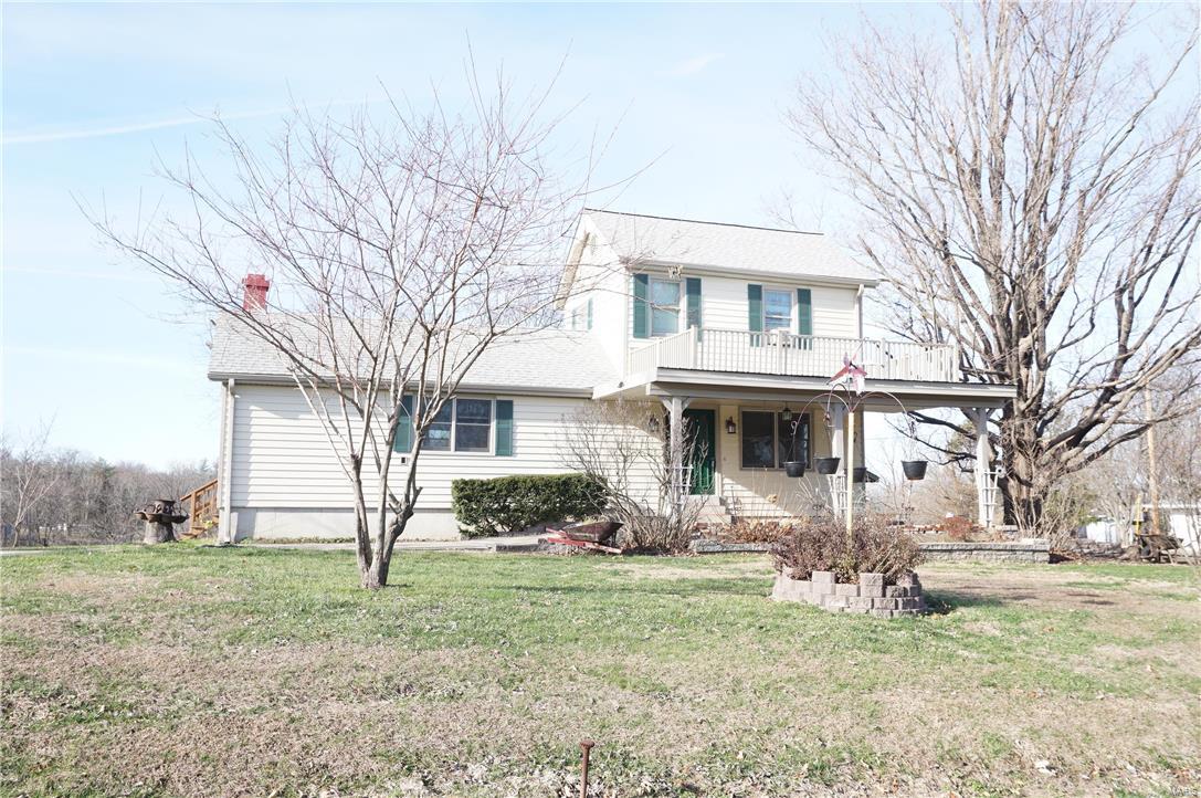 This 1/1/2 story home is an old fashion farm home with all of the charm, but many updates as well.  This 1,720 sq.ft. home has a lot of living options: Main level bedrms & upstairs bedrms & main level Great rm & open Hearth /Breakfast rm/Kitchen.  A full bedrm on each floor with, 7 car garage spaces, extra utility shed & a front door carport. This 2.33 acre mini/hobby farm is made for those who want some very large,level gardens,at least 3 plots,as well as a 2 car attached garage to the house, 2 separate 2 car garages & 2 - 1 car garages/storage sheds.The house has a 20 x 12 ft maintenance free deck which overlooks a beautiful valley.If you have always wanted to live in the country but be within commuter distance of the suburbs,this is calling your name.This property is looking for someone who has a lot of garage toys,hobbies,cars,boats,or a entrepreneur who needs to store a lot of stuff.Ask Wildwood about having a professional living-in insurance agency,CPA,law office.etc.