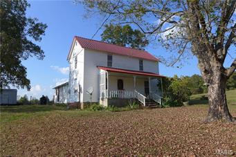 Updated 3 bedroom 1 bath farmhouse on Castor River. This home features all the modern convenience such as central HVAC, vinyl windows, updated electric & metal roof while keeping the rustic charm of living in days past. The outdoor wood furnace will keep the utility bills at bay while heating the home & hot water. 32+/- acres includes multiple springs, pasture and wooded ground. Perfect for horses, livestock or hunting. Small barn, chicken coupe & outbuildings are already in place for your homestead lifestyle or mini-farm. Relax & enjoy the view from the back porch while watching deer and wildlife daily. Opportunities abound with this wonderful property, just 8 miles from town. Call today!