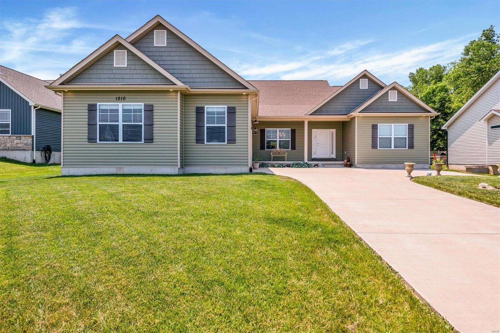 Stunning 4 year new home w/o the cost of new construction! This home has been immaculately maintained from the beginning and pride of ownership shows throughout. Stepping into the foyer shows off the open floor plan and the view of the tranquil backyard. With a formal dining room and a very spacious great room, entertaining is easy, effortless and enjoyable. Vaulted ceilings and a gas fireplace add to the dramatic feel of the living space as well as 9' ceilings and 8' doors. The gorgeous kitchen is a chef's dream from the solid surface tops down to the Thermador appliances. The owners suite not only boasts a beautiful bathroom but a sitting room as well. The divided bedroom plan includes 2 additional bedrooms and a full bath. The large laundry room leads to an oversized 33 x 24 garage. A third full bathroom and a 4th bedroom are available in the lower level including a 9' pour. Finally, enjoy the backyard with a large covered patio.  All of these amazing amenities in Rockwood Schools!