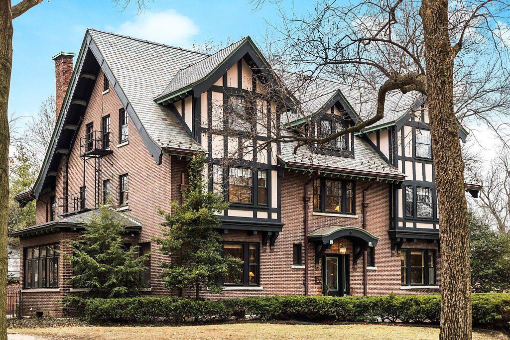 *SEE VIDEO* This 1914 Elizabethan Revival Tudor sits on a corner lot behind the historic stone gates of Kingsbury Place, a private boulevard of prestigious addresses in the Central West End. Grand entry foyer measures 30x19 & features a spectacular staircase, rich period millwork, & pocket doors. An expansive parlour features 2 sitting areas & a dramatic fireplace. The large kitchen is well appointed w/SS appliances, original butler's pantry, center island, & breakfast nook. A formal dining room with it's own sunroom makes this home an entertainer's delight. An enclosed sunroom in rear OF home leads to a fenced yard with swimming pool & 2-car garage. Take respite on the 2nd floor with a den at the top of the stairs, 2nd flr laundry, Master Suite, 3 spacious bedrooms & 2 additional baths. 3rd floor offers great flexibility & features a media room while finished basement offers exercise & rec rooms. Recent improvements include a new slate roof, copper gutters, boiler, & pool equipment. Additional Rooms: Sun Room