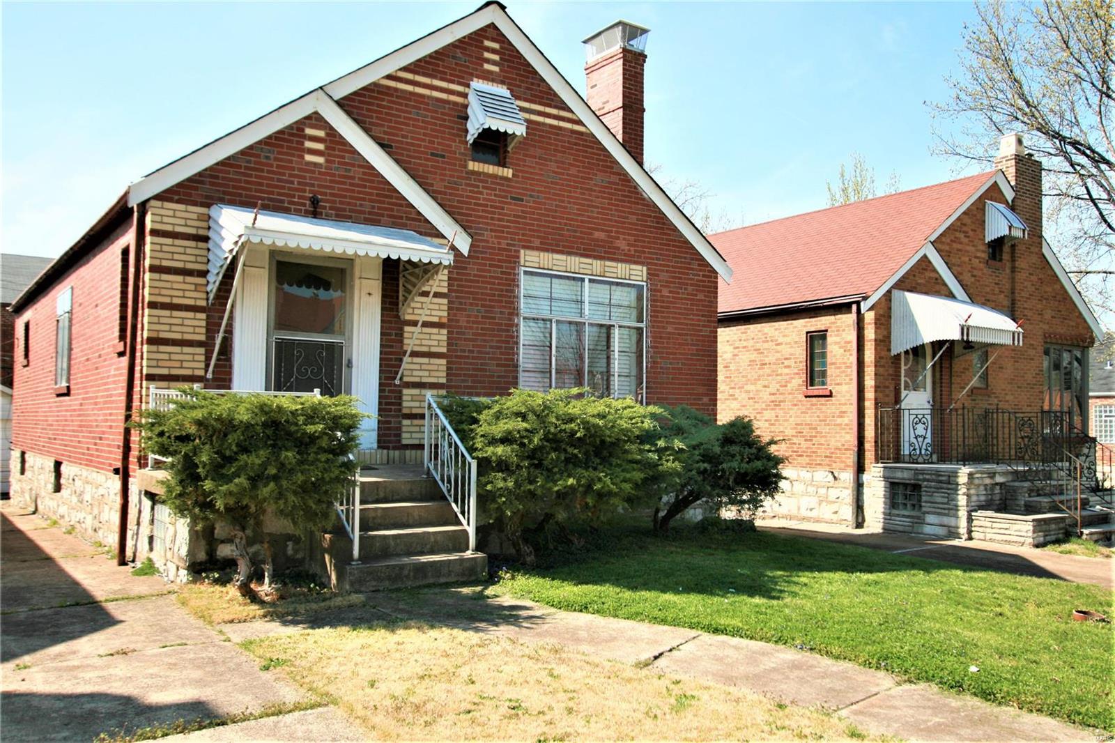 Something special about this home, it has a driveway and oversized garage.  Newly refinished all wood floors. Freshly painted interior.  Several stain glass windows, all brick home, wood-burning fireplace, all brick home. Washer and dryer in the lower level to stay with the home.  Don't miss the back porch for that cute charm.

You will not be disappointed.