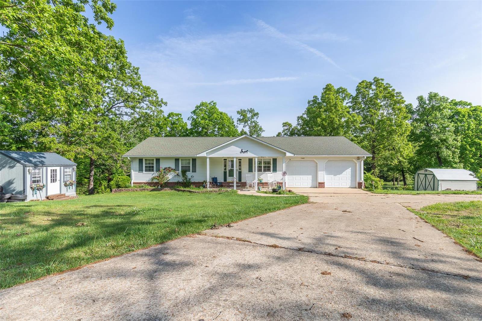 You have to check out this beautiful custom built home sitting on 9 acres +/- in the Gatewood area about 12 miles outside of Doniphan! This beautiful home was built in 2000 and has 3 bed 2 baths along with a beautiful kitchen/ dining area with like new stainless appliances! This home is extremely efficient and has been very well taken care of and has a nice dry utility basement area that is great for storage! The entire 9 acres is perfect for your mini farm with a wet weather creek, mature timber, a nice 30'x30' shop with half bathroom in it, storage buildings (one has an office in it) and much more! The beautiful 9 acres has its own private well and backs up to government land so the possibilities are endless!! Call today before this one is gone!