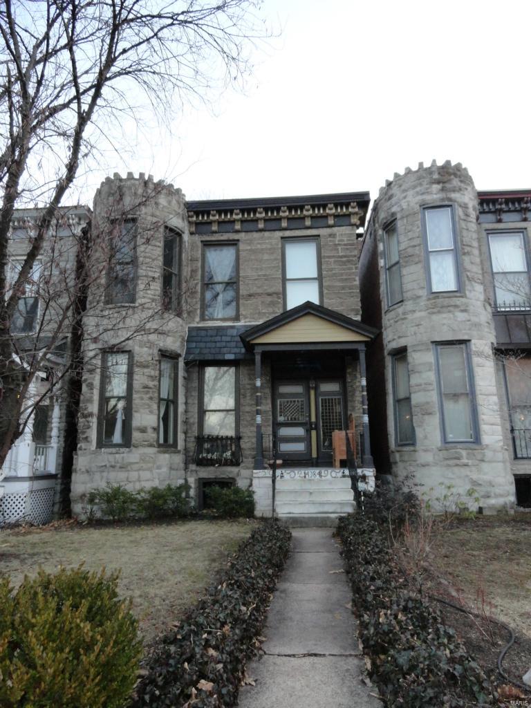 JUST REDUCED AGAIN!! Where modern amenities and historical charm meet.  You will love this 3 bedroom home located within walking distance of all that the Central West End has to offer.  You are greeted with a large foyer with a spindled staircase, historical moldings, beautiful cherry wood floors and 9’ ceilings.  The foyer leads you into the living room with a fireplace and bay window.  There is plenty of entertaining room in the large dining room and updated kitchen with 42” cabinets, built-in pantry and slate floors.  The first floor is complete with a half bath for your guests. The 2nd floor provides 3 bedrooms with a 4th room that is currently used as closet or can be turned into a small office. It also includes a full bath, transoms with stained glassed over most of the doors and a fireplace in the master bedroom.  In the Spring, enjoy relaxing on the back deck overlooking the fenced yard and one car garage. Home to be sold in AS IS condition.