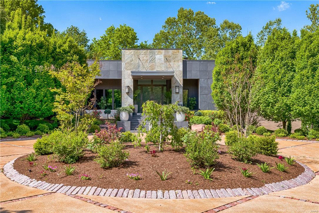 Designed by Arthur Sitzwohl is this stunning contemporary home that has been updated & enhanced.  The moment you walk in this stylish home, you will love the openness & large windows. The main level has beautiful bleached oak. The Living Room has a gas fireplace, built in cabinets & French doors that lead to the slate patio overlooking the pool. The kitchen features granite counters, plenty of cabinets, 5-burner Wolf gas stove, Sub-zero refrigerator & wine cooler & a breakfast room with doors that lead to the back terrace.  The master bedroom suite is private, apart from the other bedrooms & features a den/office & large dressing room with a huge walk-in closet. The bathroom has dual vanities, separate soaking tub, lots of built-ins & a dual head rain shower. 3 other bedrooms & 2 full baths are on the other wing of the home. The walkout lower level features a recreation room that could be a 5th bedroom & another full bath.  The backyard has a saltwater pool, waterfall & hot tub. Additional Rooms: Mud Room