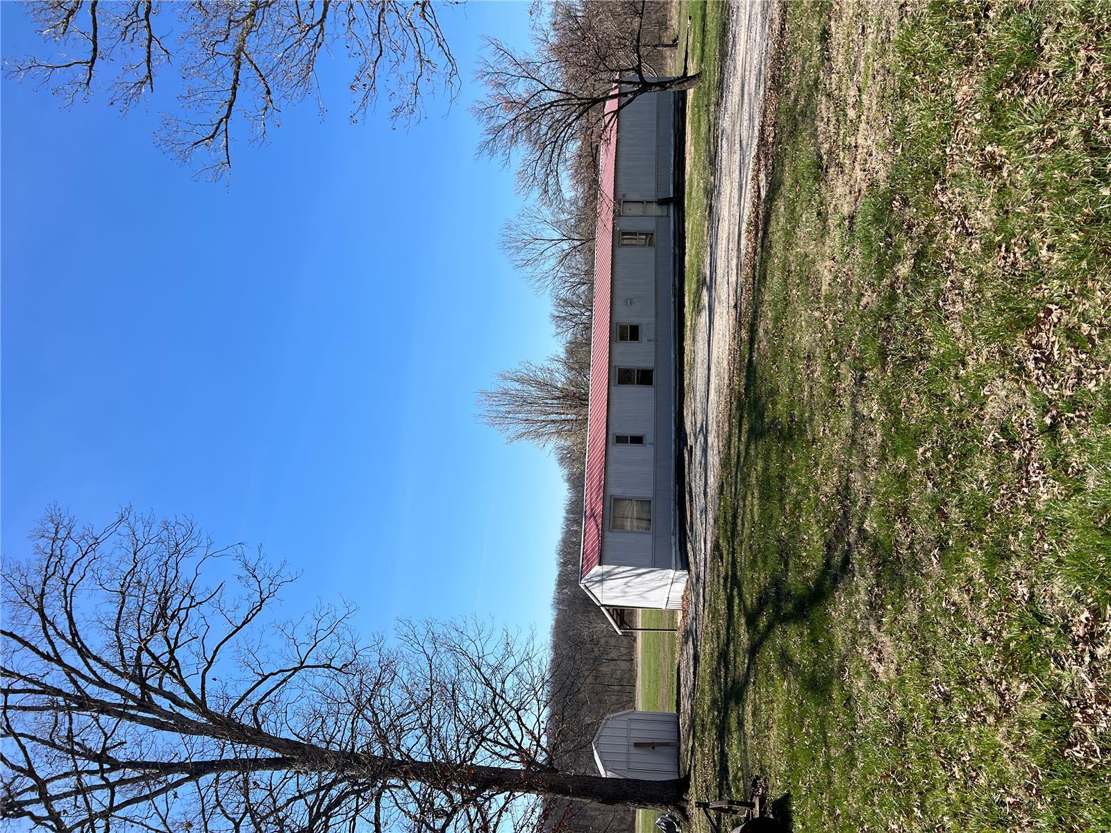 Amazing hard to find 12.61 ac small acreage! Build your dream home or just a getaway at the end of a country road! Creek runs through the rear wooded area of the property. Has a newer 20'x32' pole framed camper port with electric and a cistern, 16'x30' storage outbuilding. Older Manufactured home on the property has no monetary value. Wildlife galore!! Bring the family and come take a look!