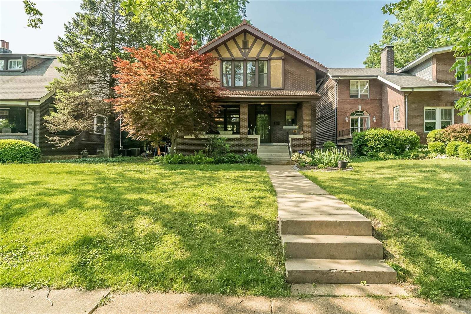 Charming Southwest Garden 2-story nestled on a quiet street 1 block from Tower Grove park. This Beautifully Rehabbed Brick 2 Story 3 Bedroom 2 full & 2 half Bath Gem sits on Quiet Tree Lined Street! The Fantastic front porch invites you in to the lovely light-filled foyer with half bath open floor plan with large living room dining room & custom kitchen with a center island quartz tops, stainless steel appliances. Family room has beamed ceiling & wall of windows that look out over your lushly landscaped huge yard, patio, full garden, covered deck with hot tub & garage. Upstairs you will find three big bedrooms, an owners suite with a renovated full bath, walk in shower, & double sinks, the second full bath is also renovated with tub shower combo & double vanity. The Walk-out basement is ready for your finishing touches & adds a half bath, laundry & lots of storage. Walking distance to Tower Grove Park, outdoor summer concerts at Botanical Gardens, and many amazing dinners on The Hill!