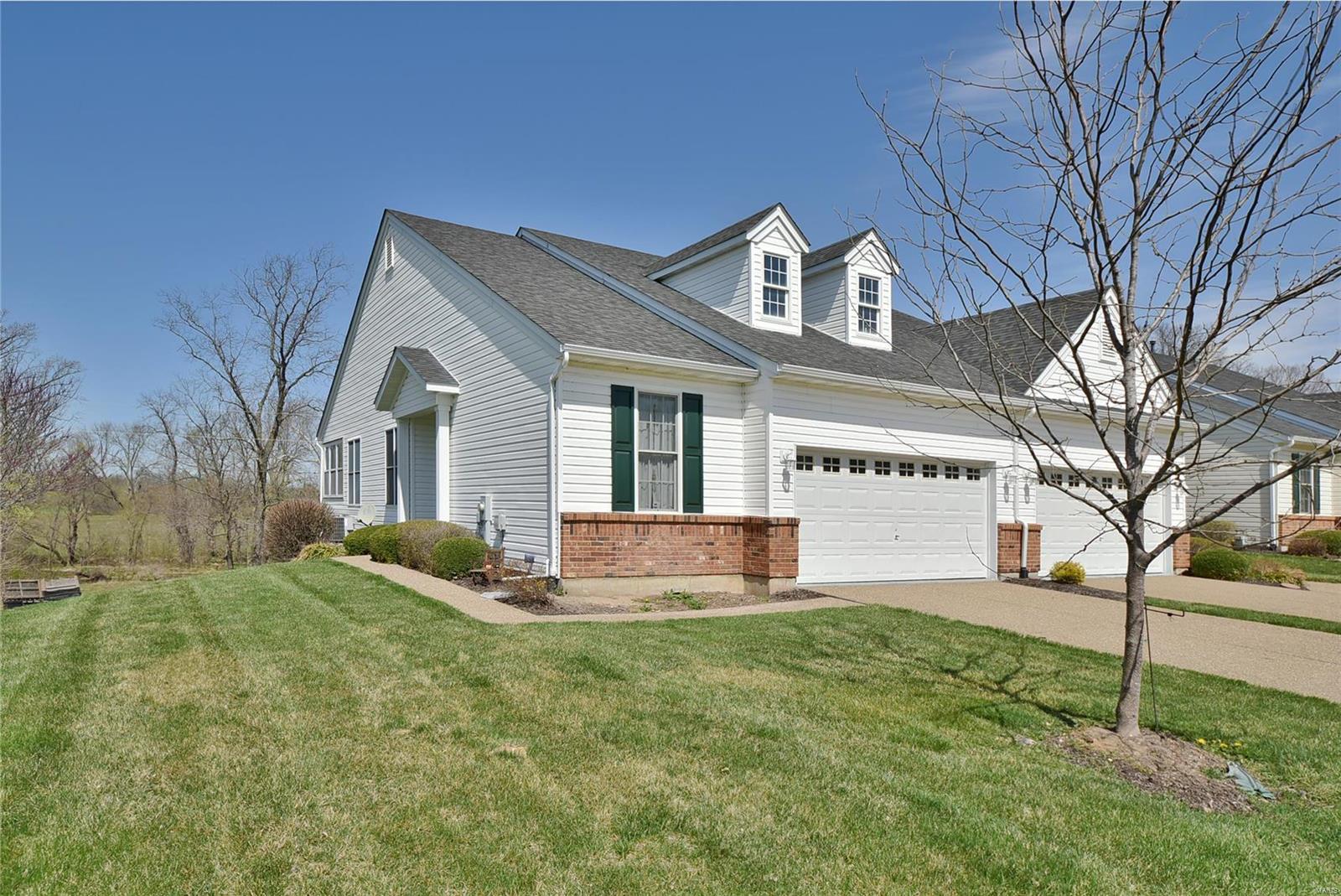 Prepare to fall in love with this wonderful 3 bed/3 bath villa that backs to gently rolling hills & woods. The inviting open floorplan welcomes you with a formal entry foyer that flows naturally into the spacious living room that includes French doors to the den, sliding glass walk-out to the glass-enclosed porch & a pass-through to the big eat-in kitchen with ample 42in custom cabinetry, pantry & adjacent main floor laundry. The divided bedroom floorplan features a generously sized master suite that boasts a private full bath with double vanity & walk-in shower + a walk-in closet. The main floor includes 2 bedrooms & 2 full bathrooms while the LL adds the 3rd bedroom, 3rd full bathroom & a large family room with recessed wetbar & sliding glass walk-out to the patio. Coming Home is always a breeze with the attached 2-car garage, private driveway & additional guest parking. Treat yourself with an Appointment Today! Duplicate listing of 21020369.